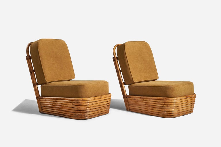 A pair of bamboo and mustard yellow fabric lounge chairs designed and produced by an American designer, United States, 1960s.





