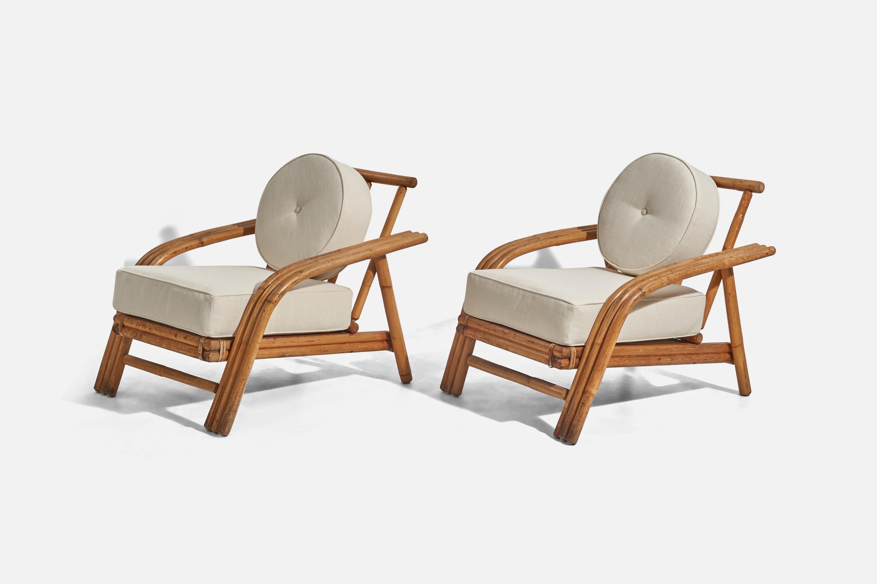 A pair of white fabric and bamboo lounge chairs designed and produced by an American designer, United States, 1950s.





