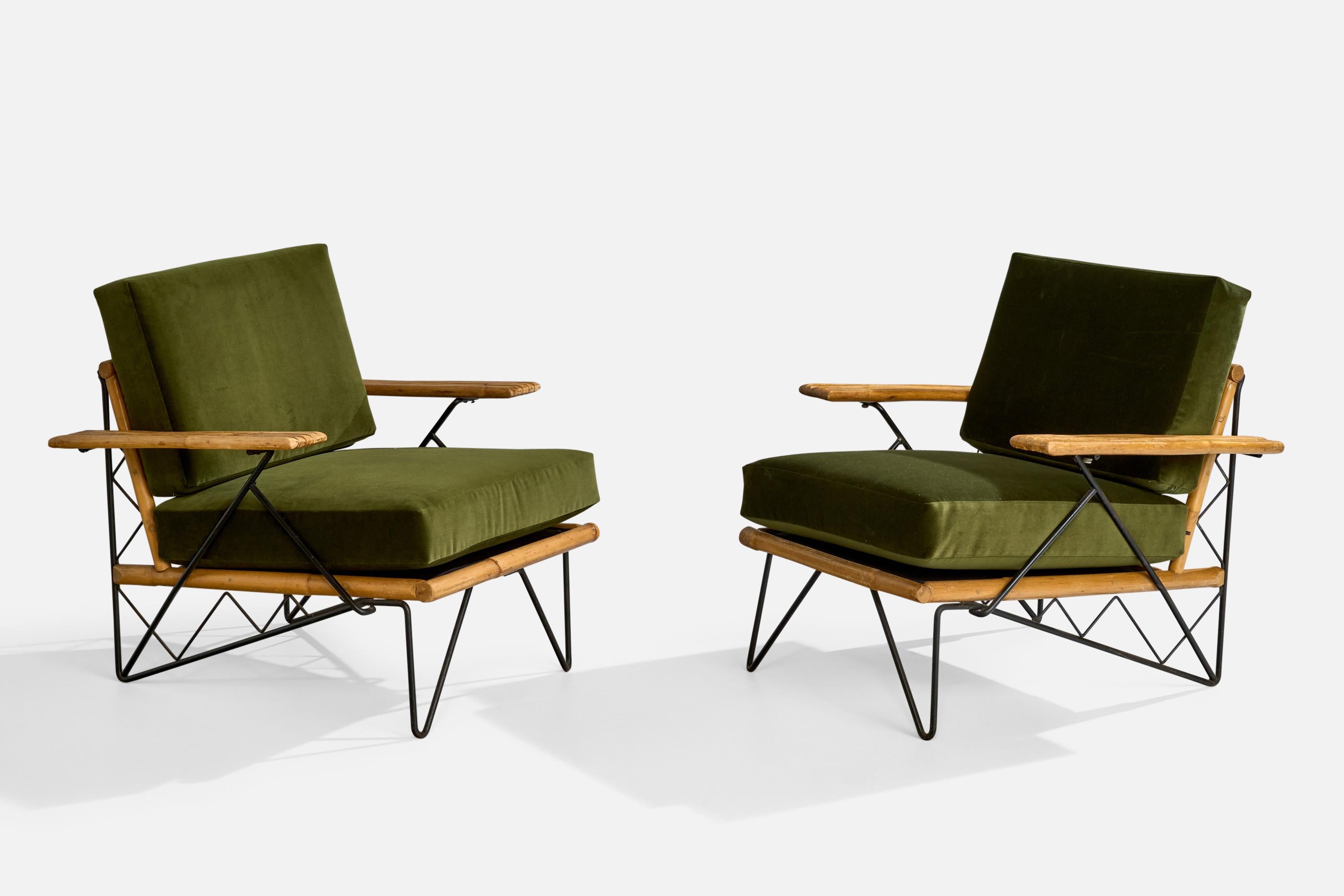 A pair of black-painted iron, bamboo and green velvet lounge chairs designed and produced in the US, c. 1950s.

Dimensions: 31.5” H x 31” W x 31.5” D

Seat Height: 18”