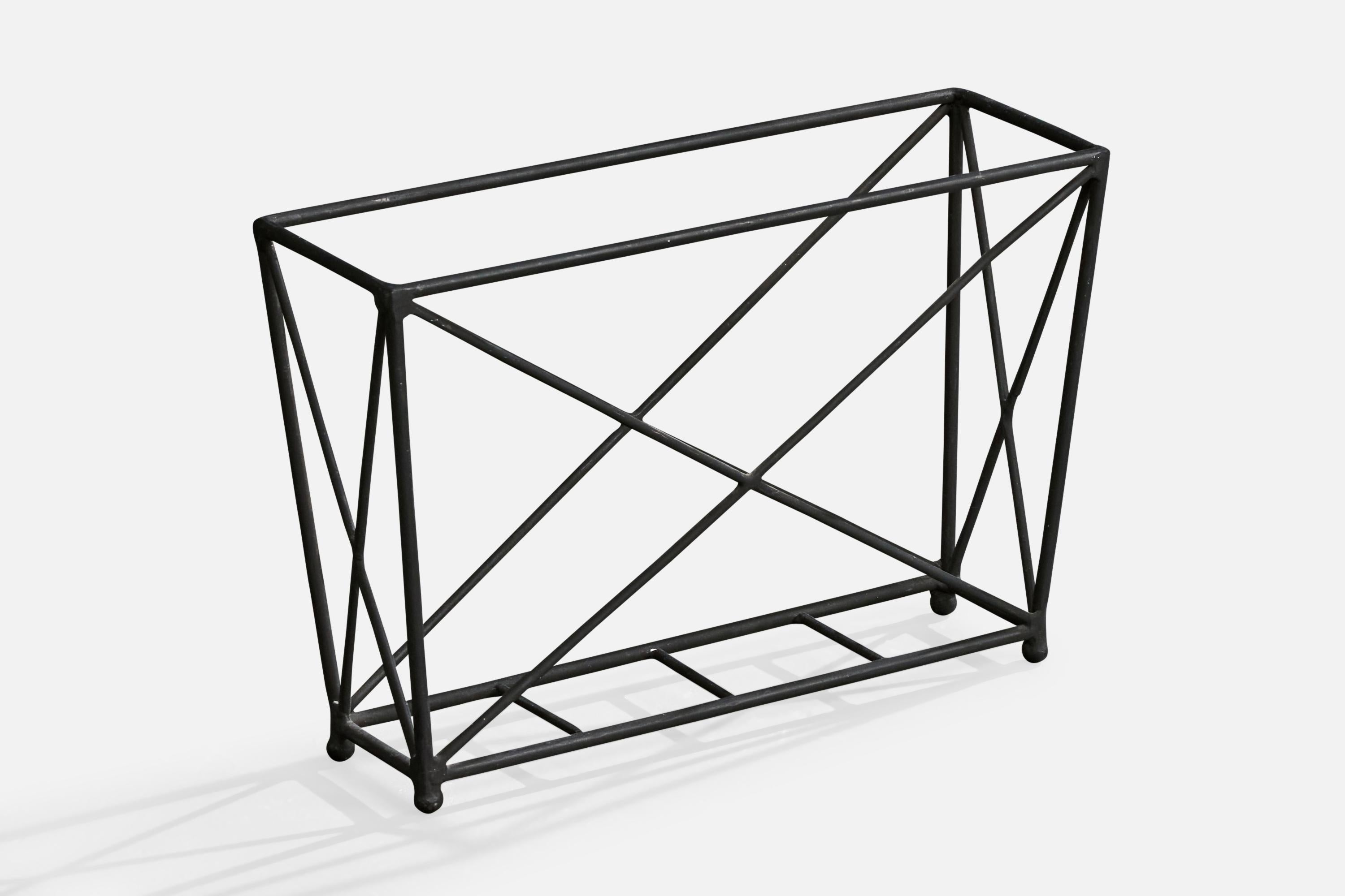 An iron magazine stand or magazine holder designed and produced in the US, c. 1950s.

Overall Dimensions (inches): 12.0