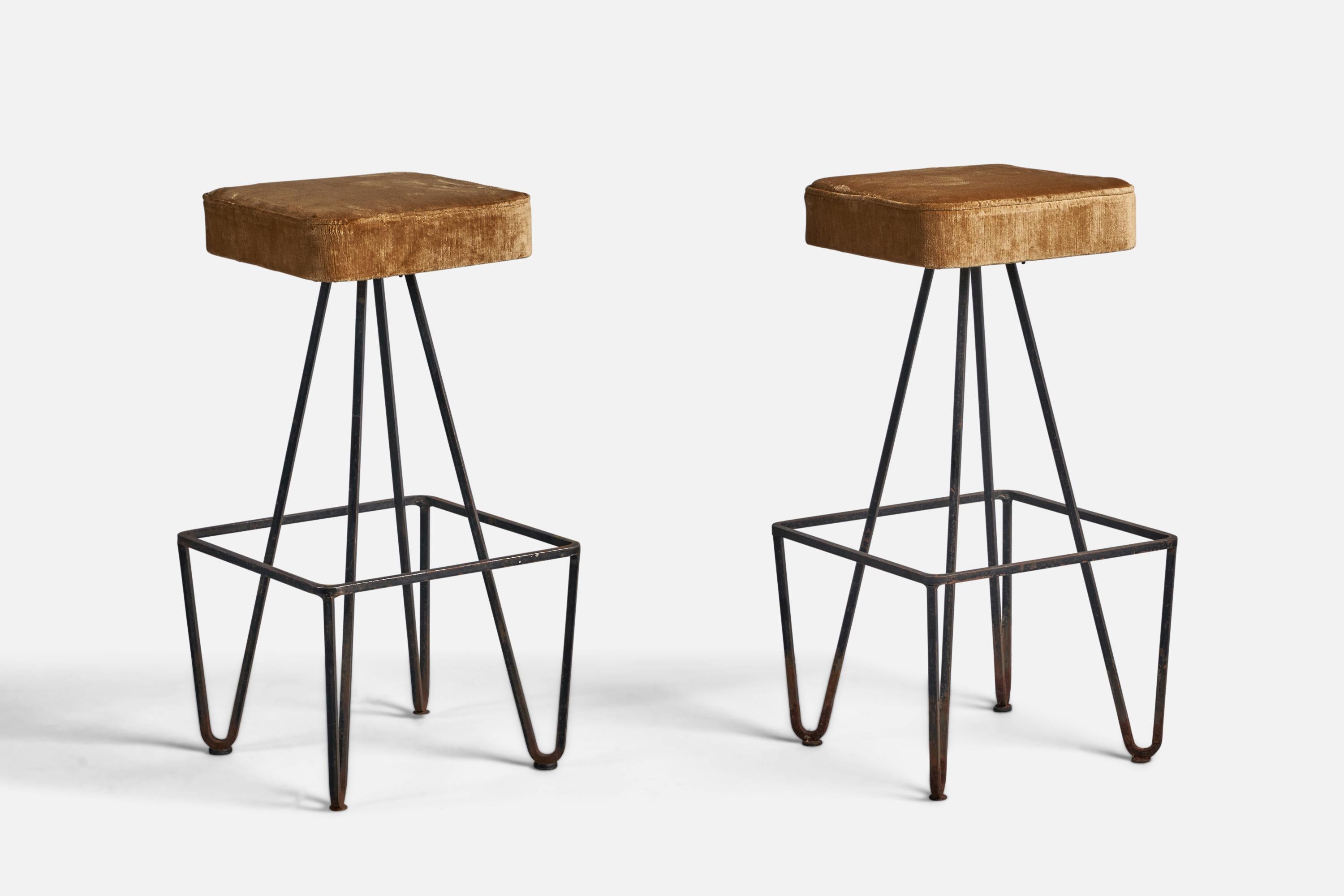 A pair of black-painted iron and beige velvet bar stools, designed and produced in the US, 1950s.

