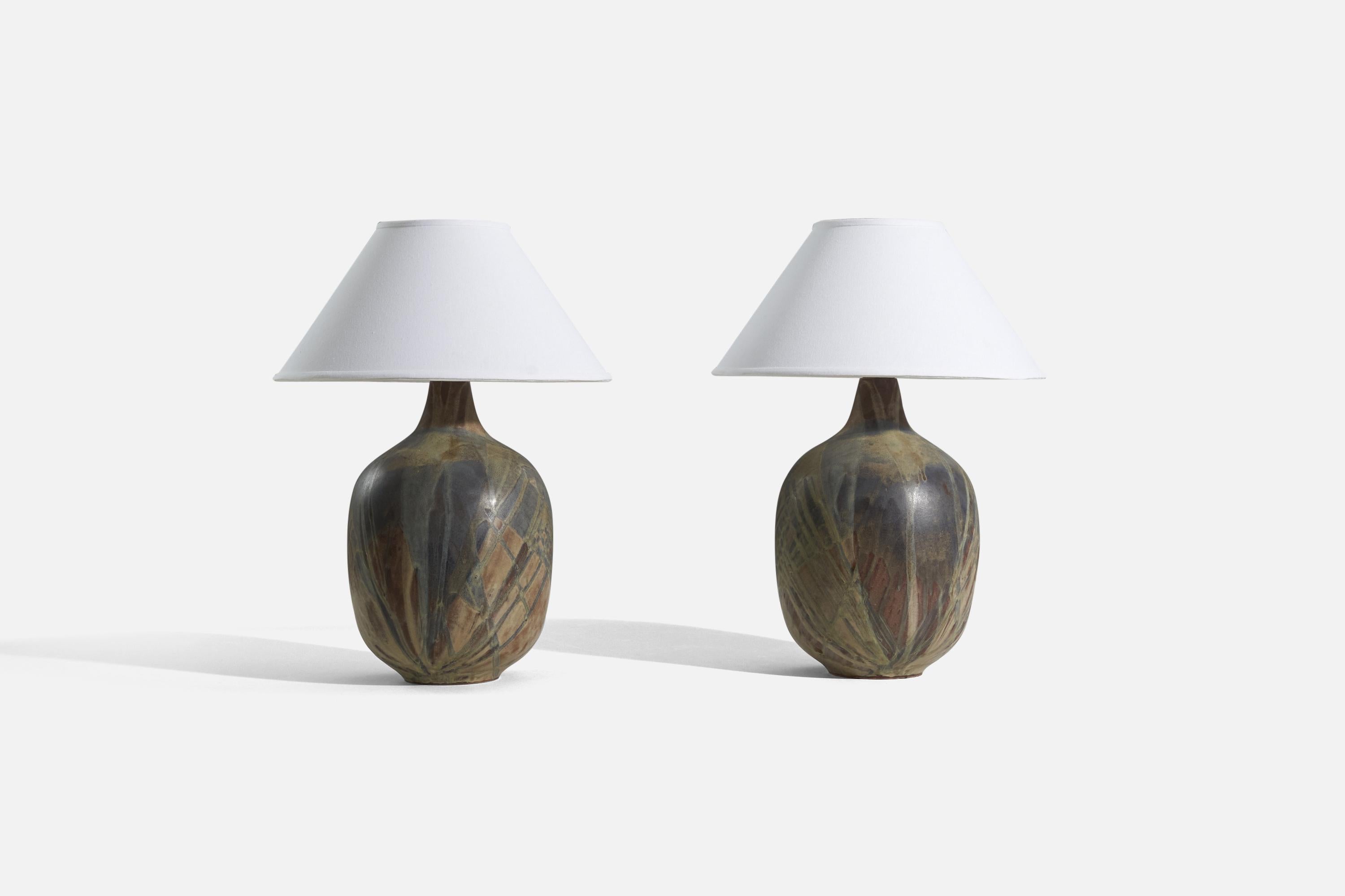 A pair of large ceramic table lamps designed and produced in United States, 1960s.

Sold without lampshade. 
Dimensions of Lamp (inches) : 19 x 9.25 x 9.25 (H x W x D)
Dimensions of Shade (inches) : 6 x 16 x 9.25 (T x B x H)
Dimension of Lamp