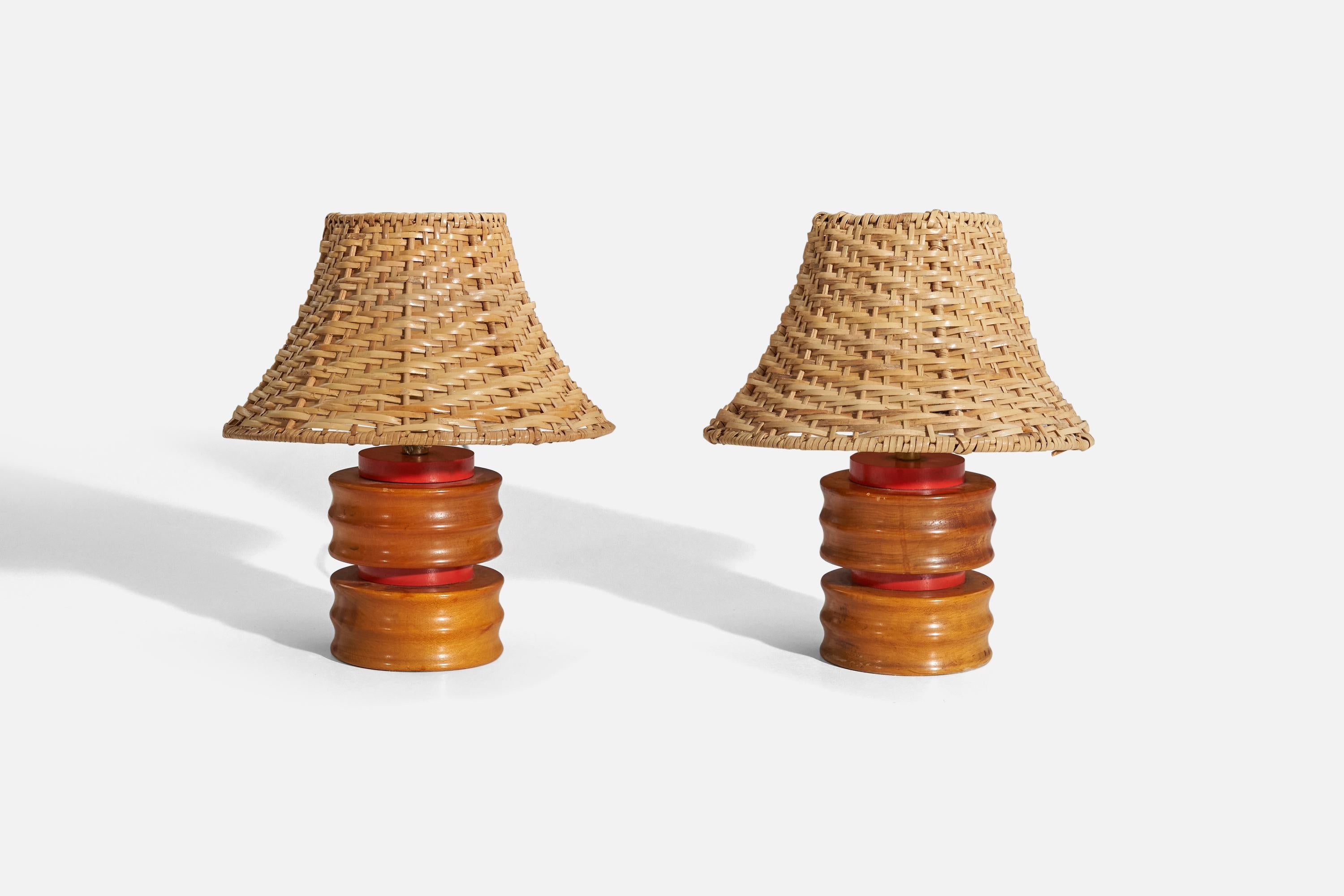 A pair of wooden table lamps designed and produced in the United States, 1960s.

Sold without lampshade. 
Dimensions of Lamp (inches) : 7.0625 x 3.875 x 3.875 (H x W x D)
Dimensions of Shade (inches) : 4 x 8.75 x 5.5 (T x B x H)
Dimension of