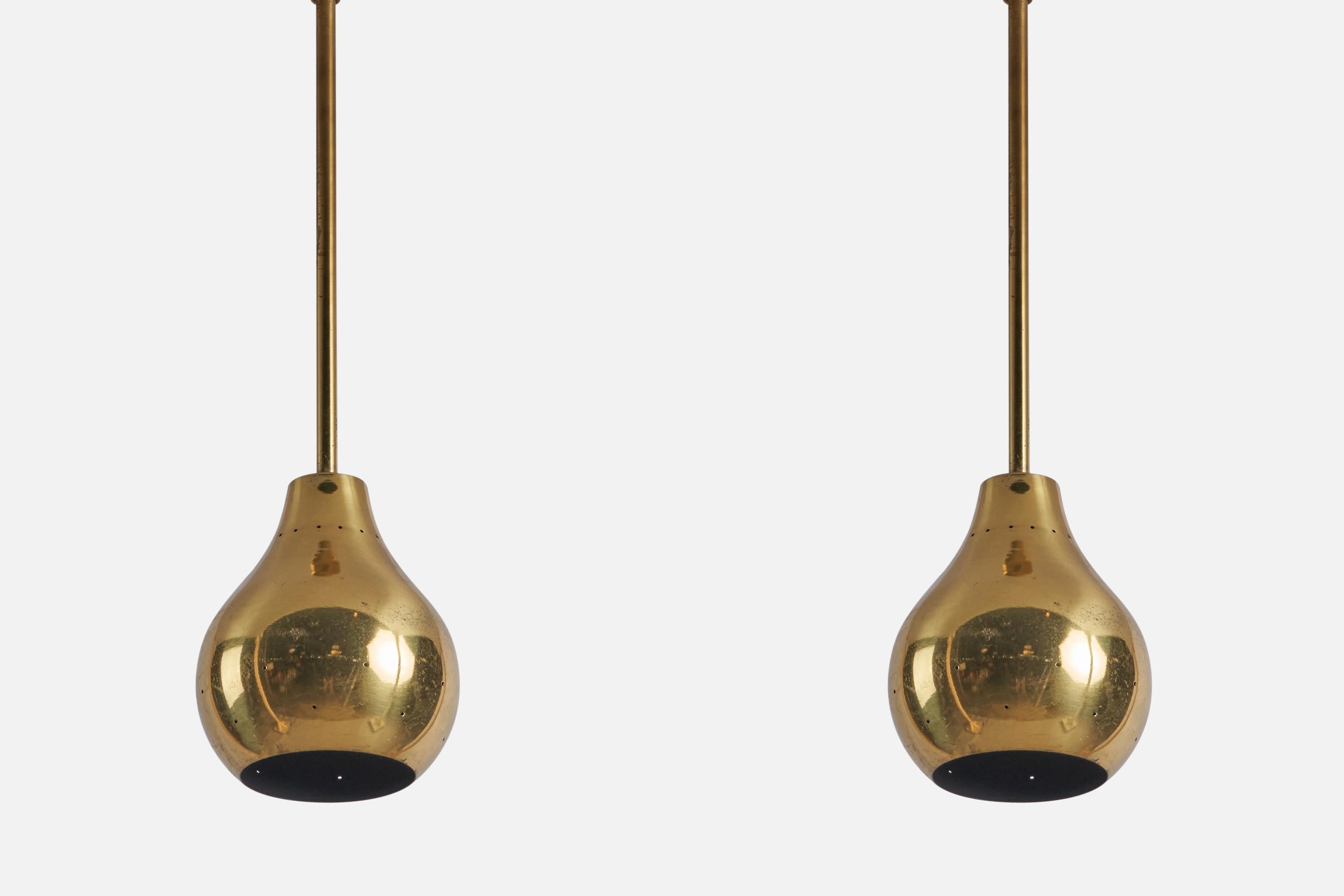 A pair of brass pendant lights designed and produced in the US, 1950s.

Overall Dimensions (inches): 22” H x 6.5” Diameter

Bulb Specifications: E-26 Bulb

Number of Sockets: 1

Ceiling roses intended for hardwiring not illustrated, please inquire