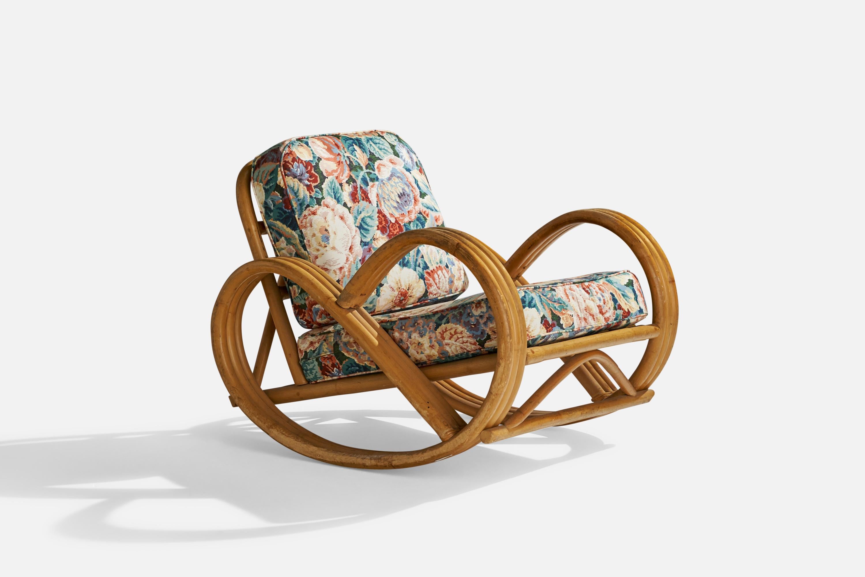 A moulded bamboo and floral printed fabric rocking lounge chair designed and produced in the US, c. 1950s.

seat height 14”.
