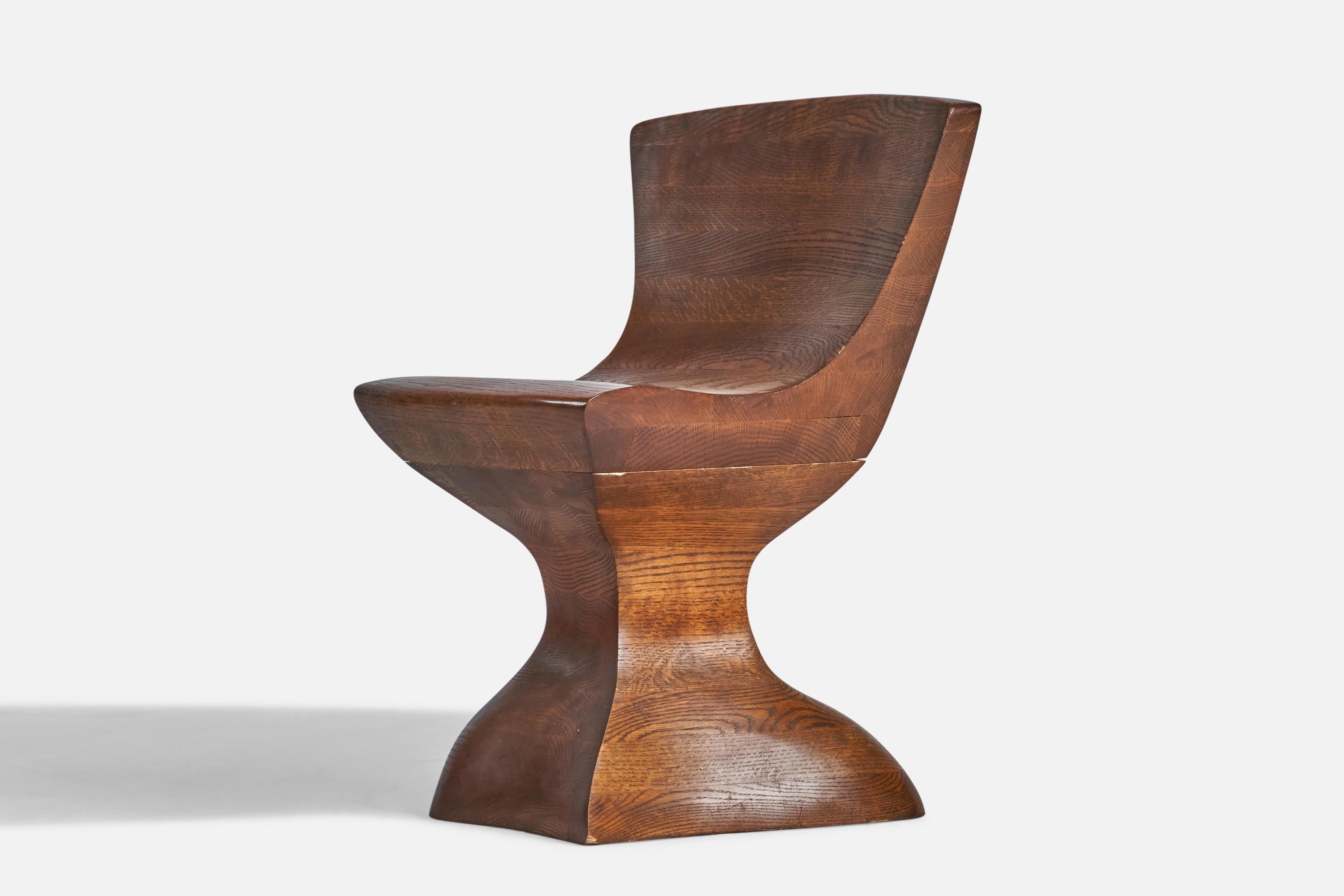 A laminated and carved oak side chair designed and produced in the US, c. 1980s.
16.75” seat height