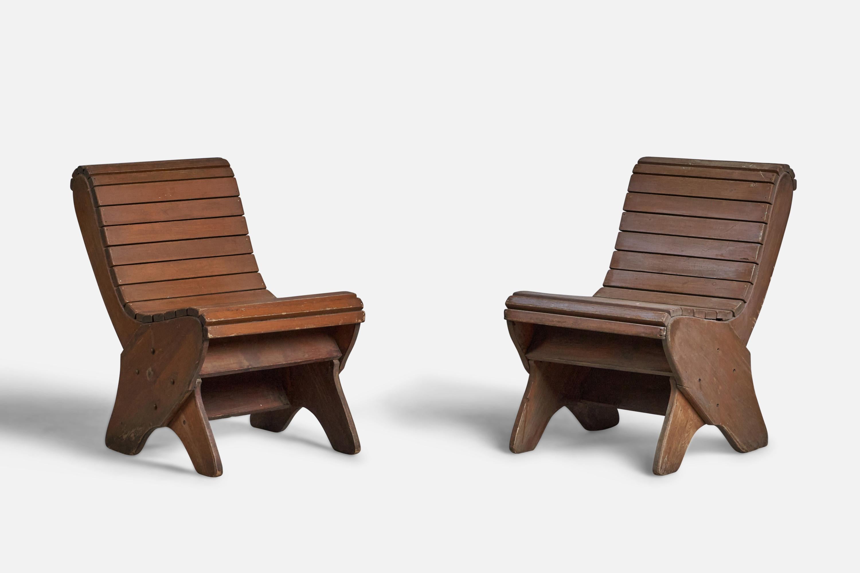 A pair of stained wood side chairs designed and produced in the US, c. 1940s.
16” seat height