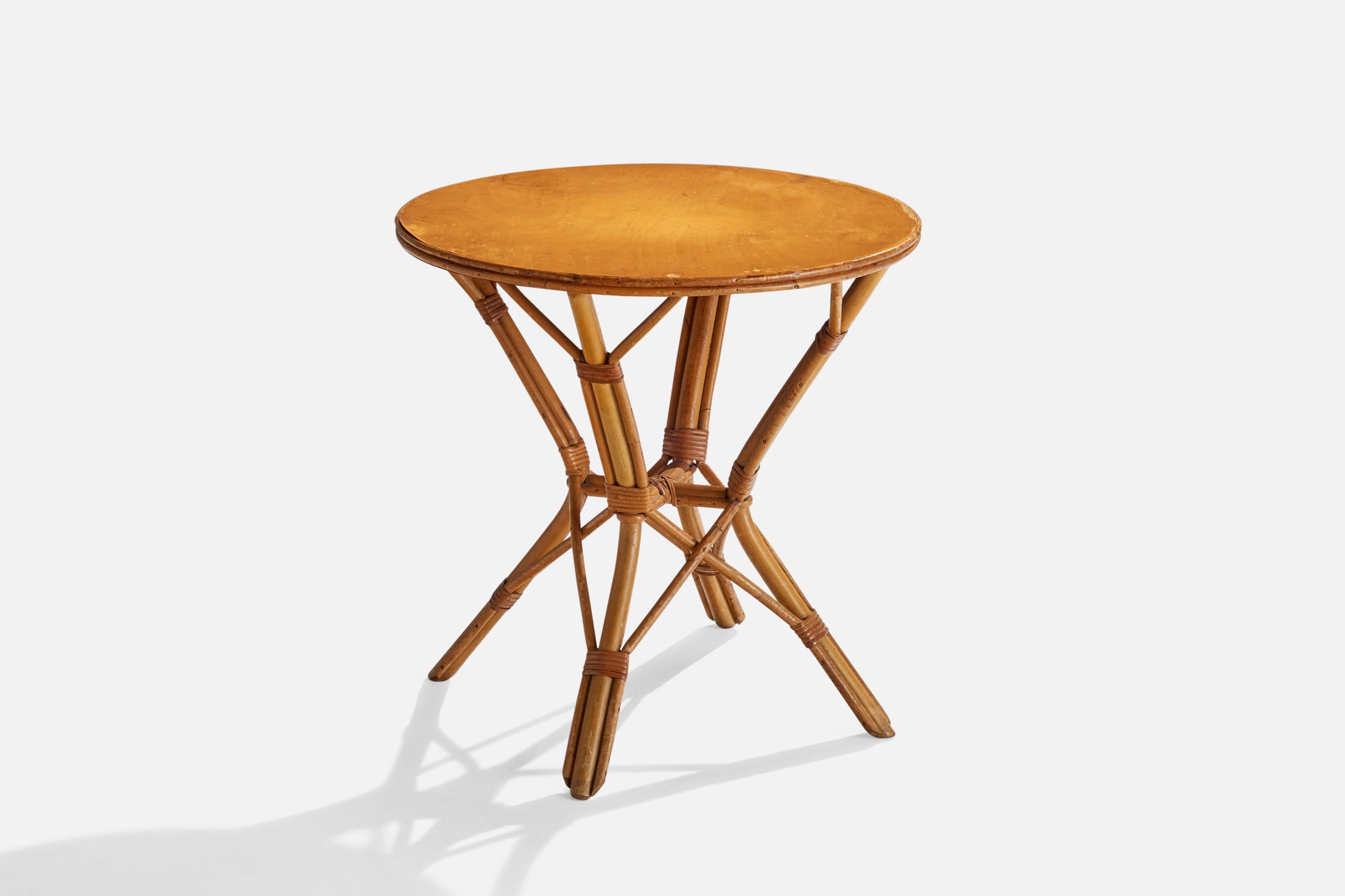 A bamboo, rattan and wood side table designed and produced in the US, c. 1950s.