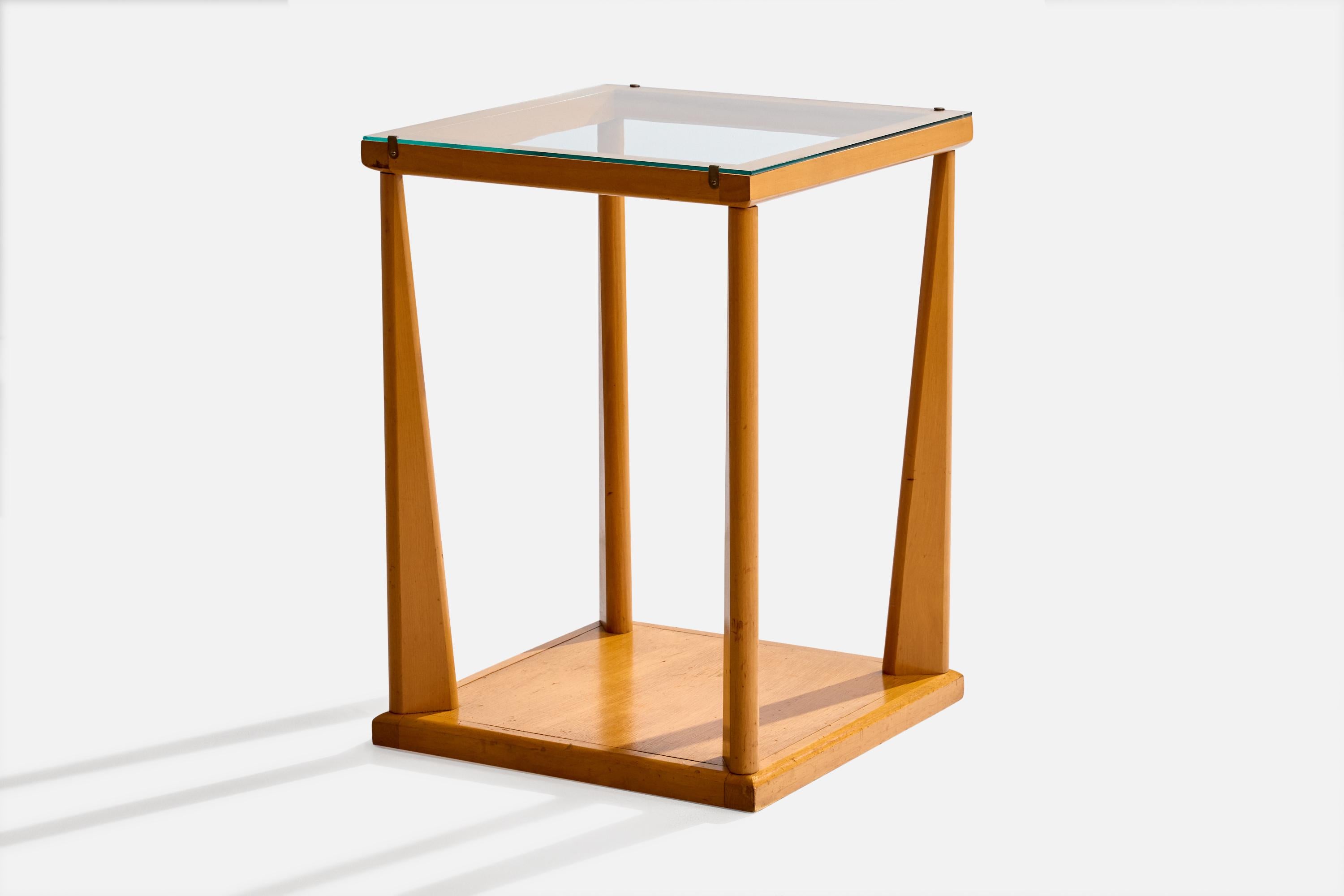 A bleached mahogany, glass and metal side table designed and produced in the US, c. 1950s.

Overall Dimensions (inches): 28.125