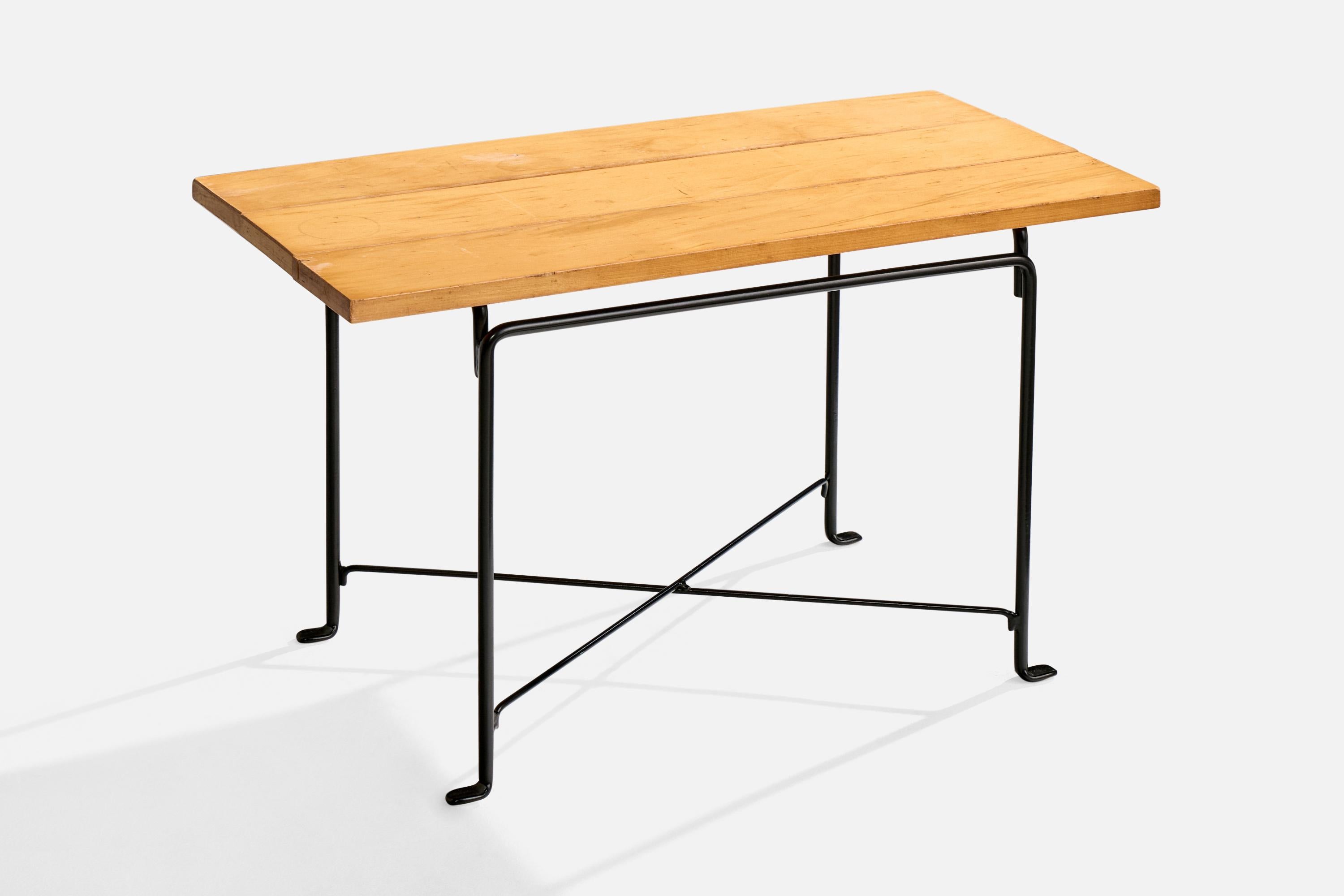 A maple and black-painted iron side table designed and produced in the US, c. 1950s.

Overall Dimensions (inches): 18.0