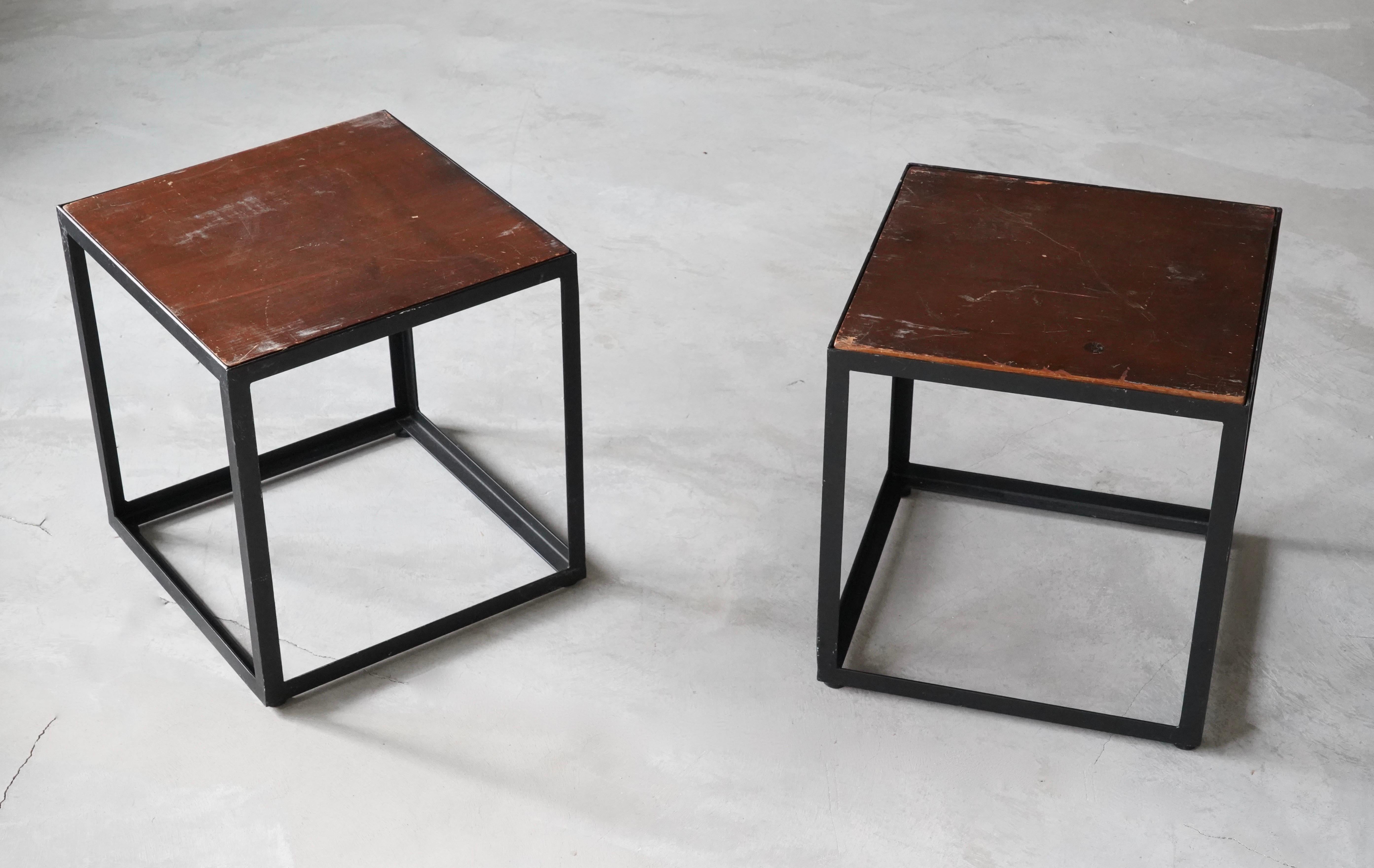 A set of two simple and functionalist side tables / occasional tables. In lacquered metal with wooden tops. Has dramatic original patina. Reversible wooden tops.

Other designers of the period include Poul Kjaerholm, Marcel Breuer, Pierre Chareau,