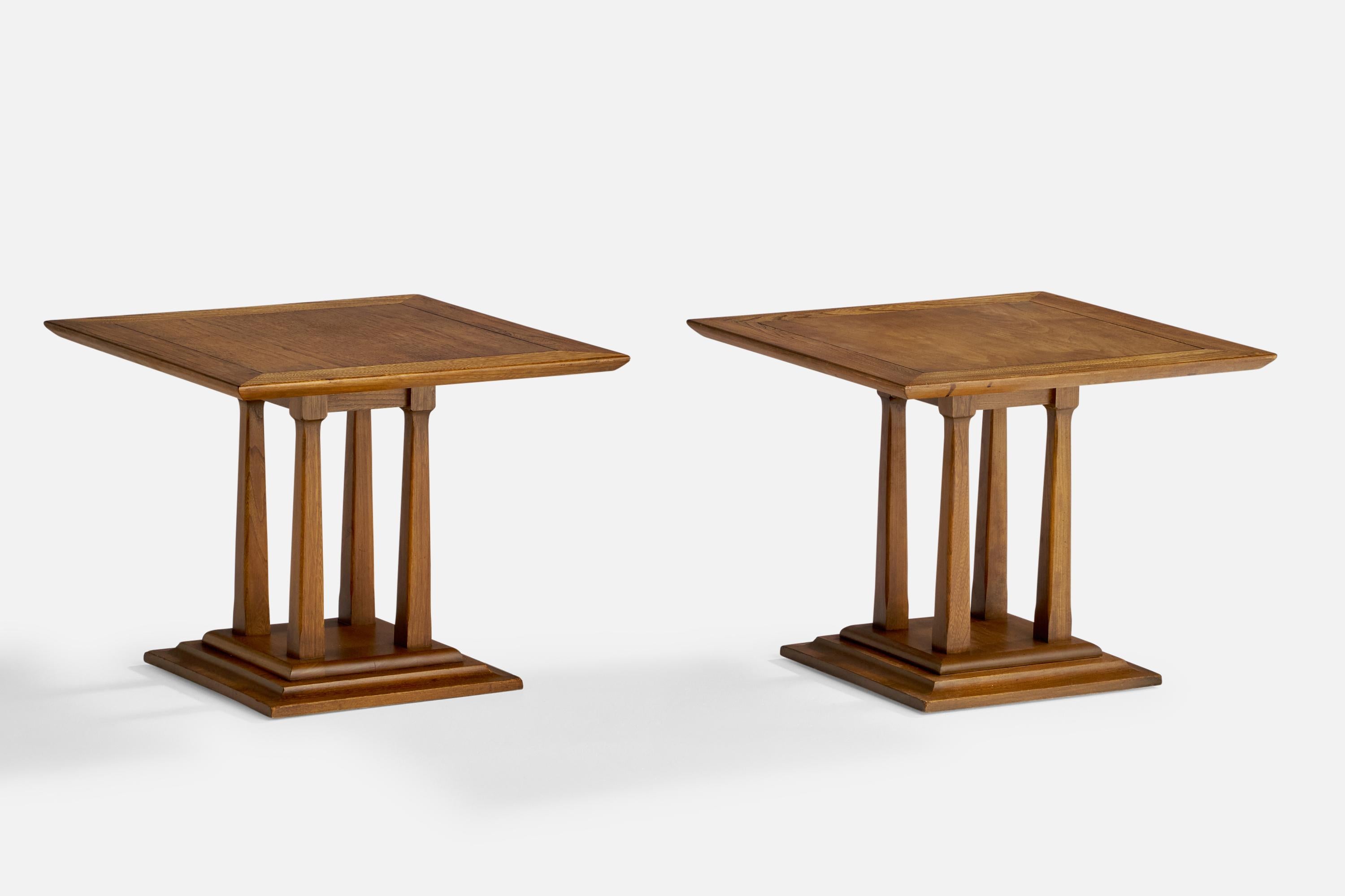 A pair of walnut side tables designed and produced in the US, 1940s.