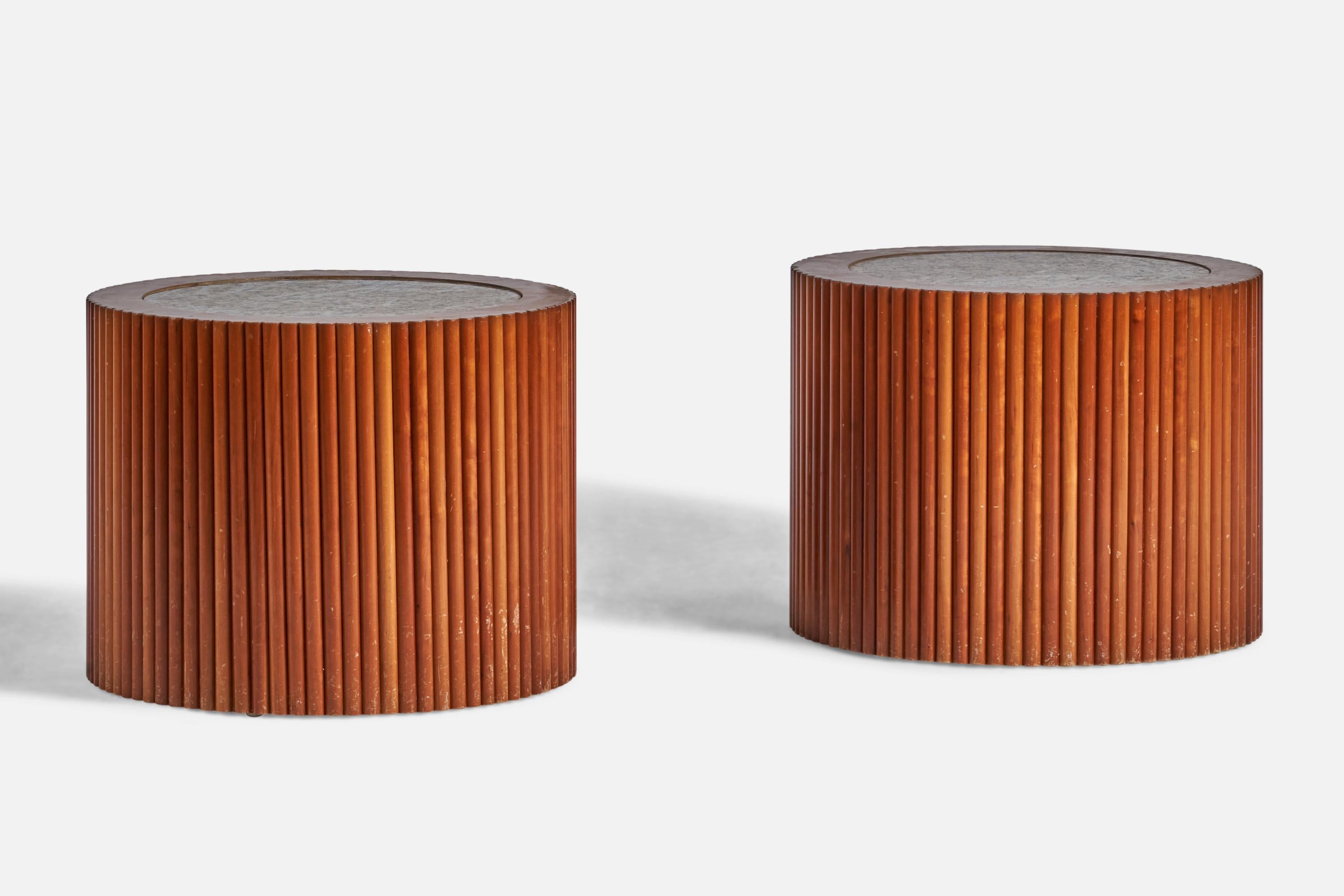 A pair of carved wood and granite side tables designed and produced in the US, c. 1970s.