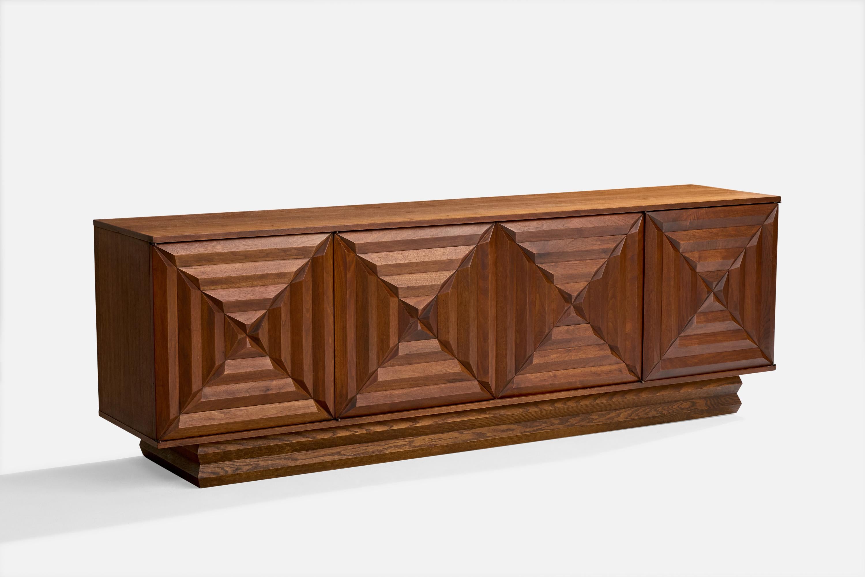 A sizeable dark-stained oak sideboard or cabinet designed and produced in the US, c. 1960s.

Overall Dimensions (inches): 29.0
