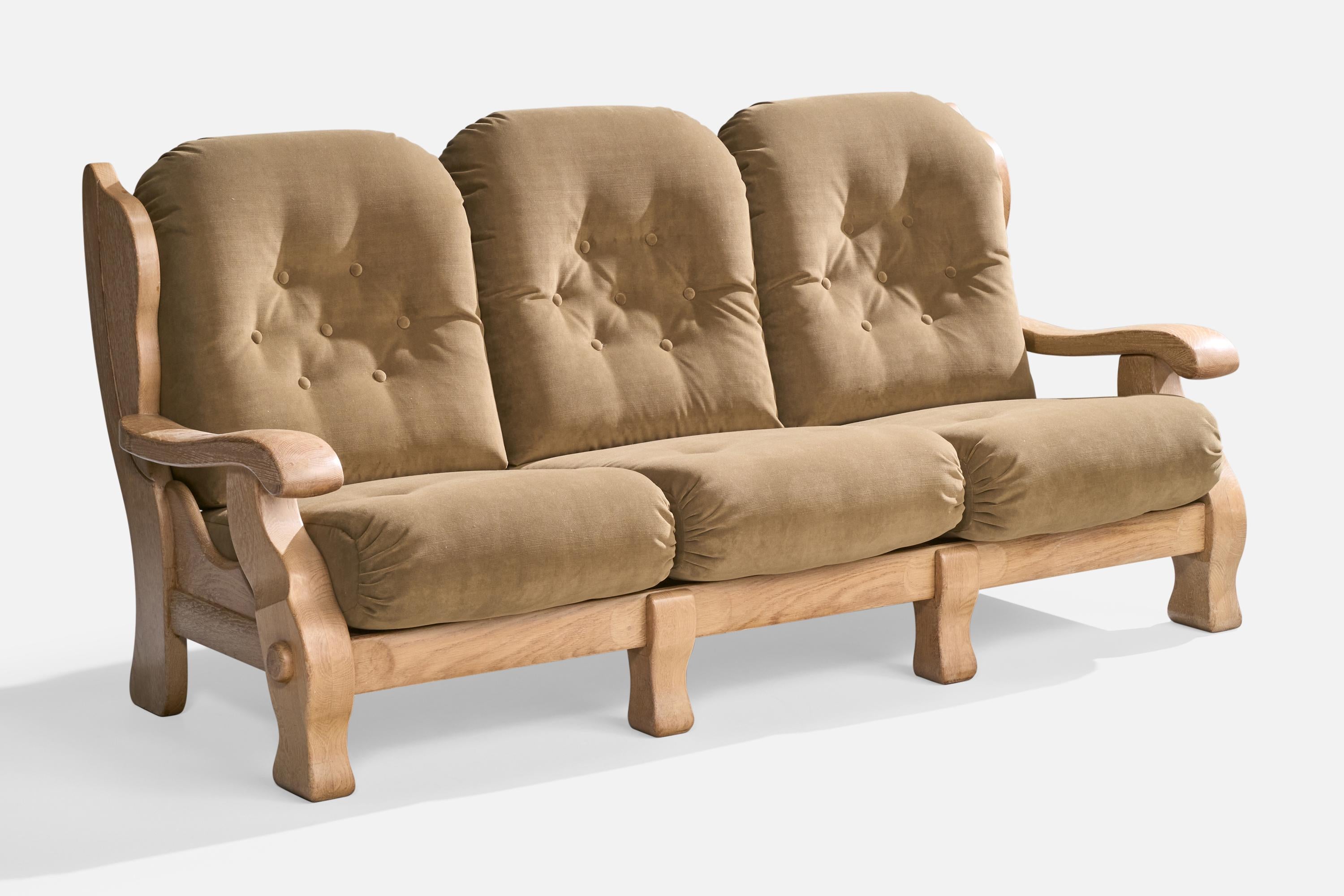 An oak and green-velvet sofa designed and produced in the US, c. 1950s.

Reupholstered in brand new velvet.

Dimensions: 37.5” H x 78” W x 35” D

Seat Height: 18”

All upholstered furniture can be reupholstered upon request for an additional fee.