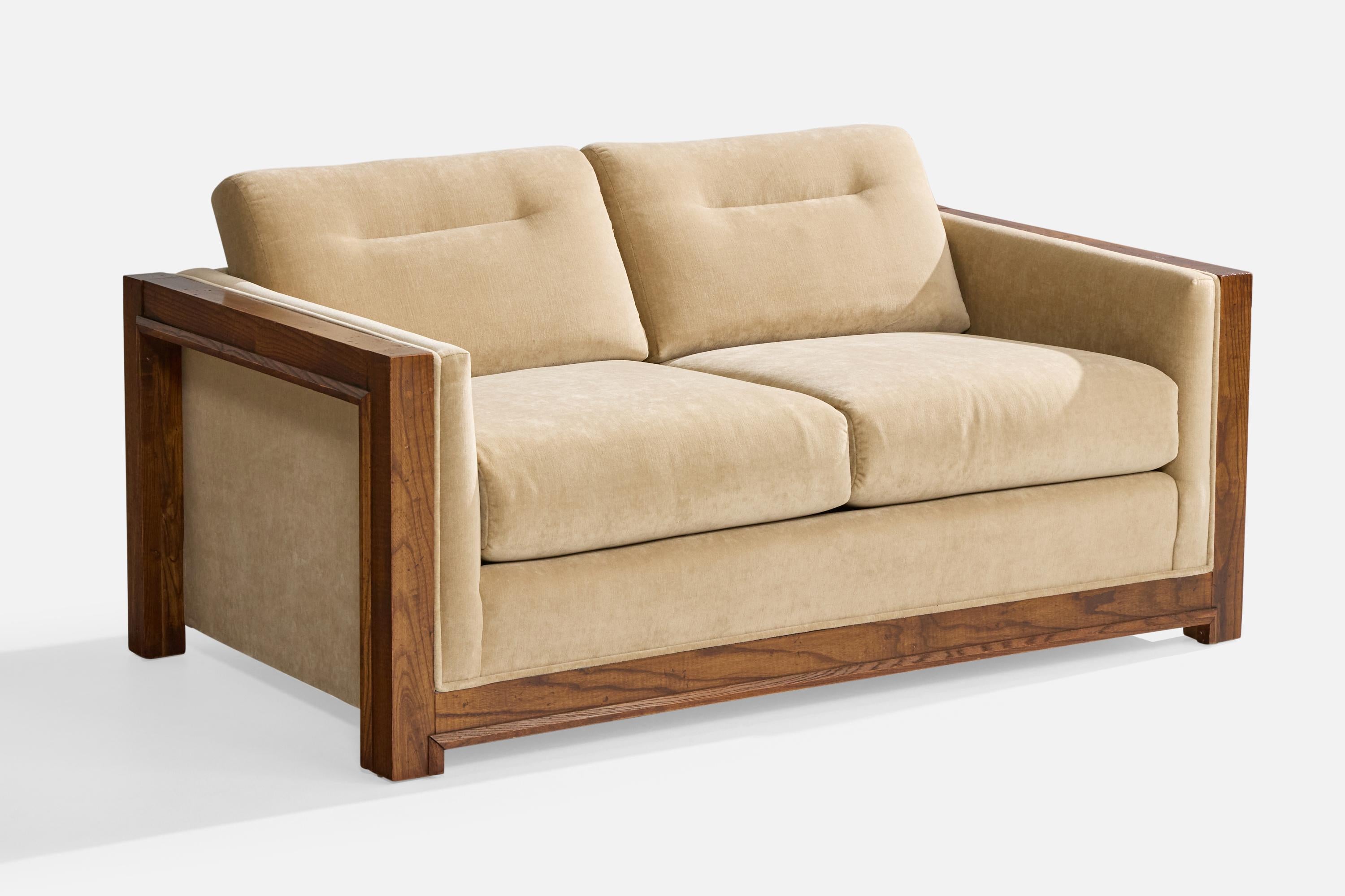 A beige velvet and oak sofa designed and produced in the US, c. 1950s.

Reupholstered in brand new velvet.

Overall Dimensions (inches): 29.5” H x 60.25” W x 33.5” D

Seat Height (inches): 18”

Arm Height (inches): 23.25”

All upholstered furniture