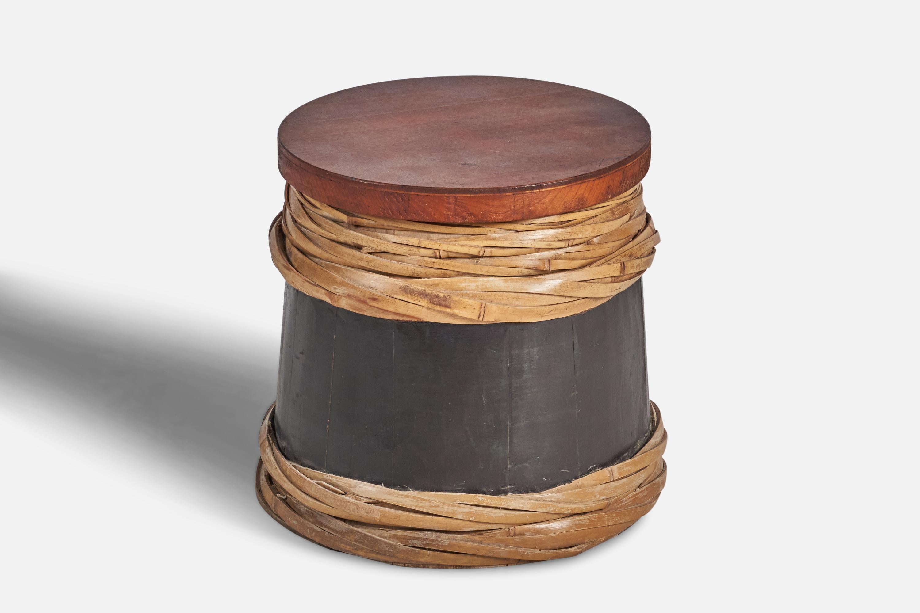 A teak, black-painted wood and rattan stool designed by an American architect and custom-produced in the Philippines, 1950s.