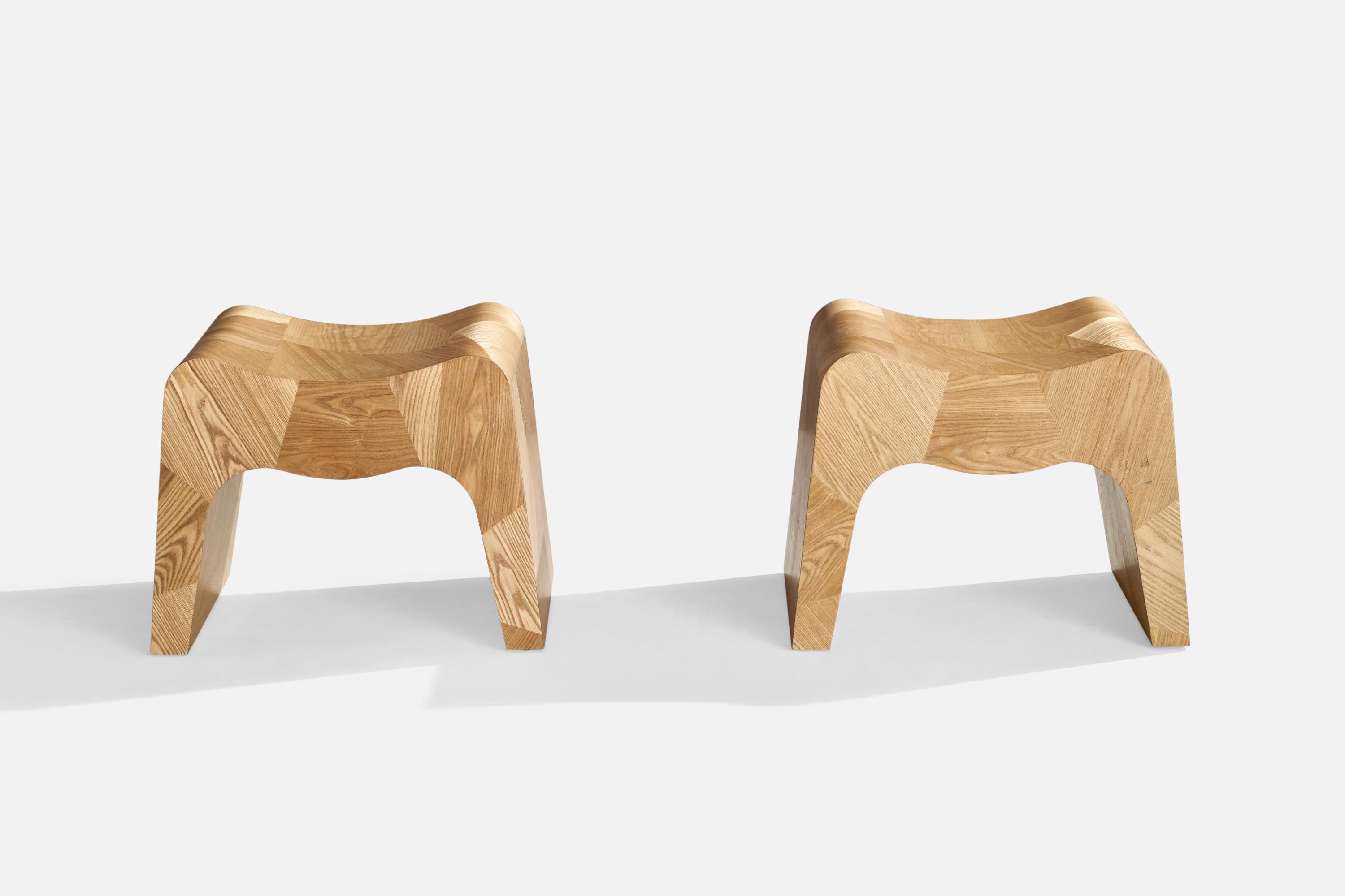 A pair of custom-made oak stools designed and produced in the US, c. 1980s.

Seat Height (inches): 16.63