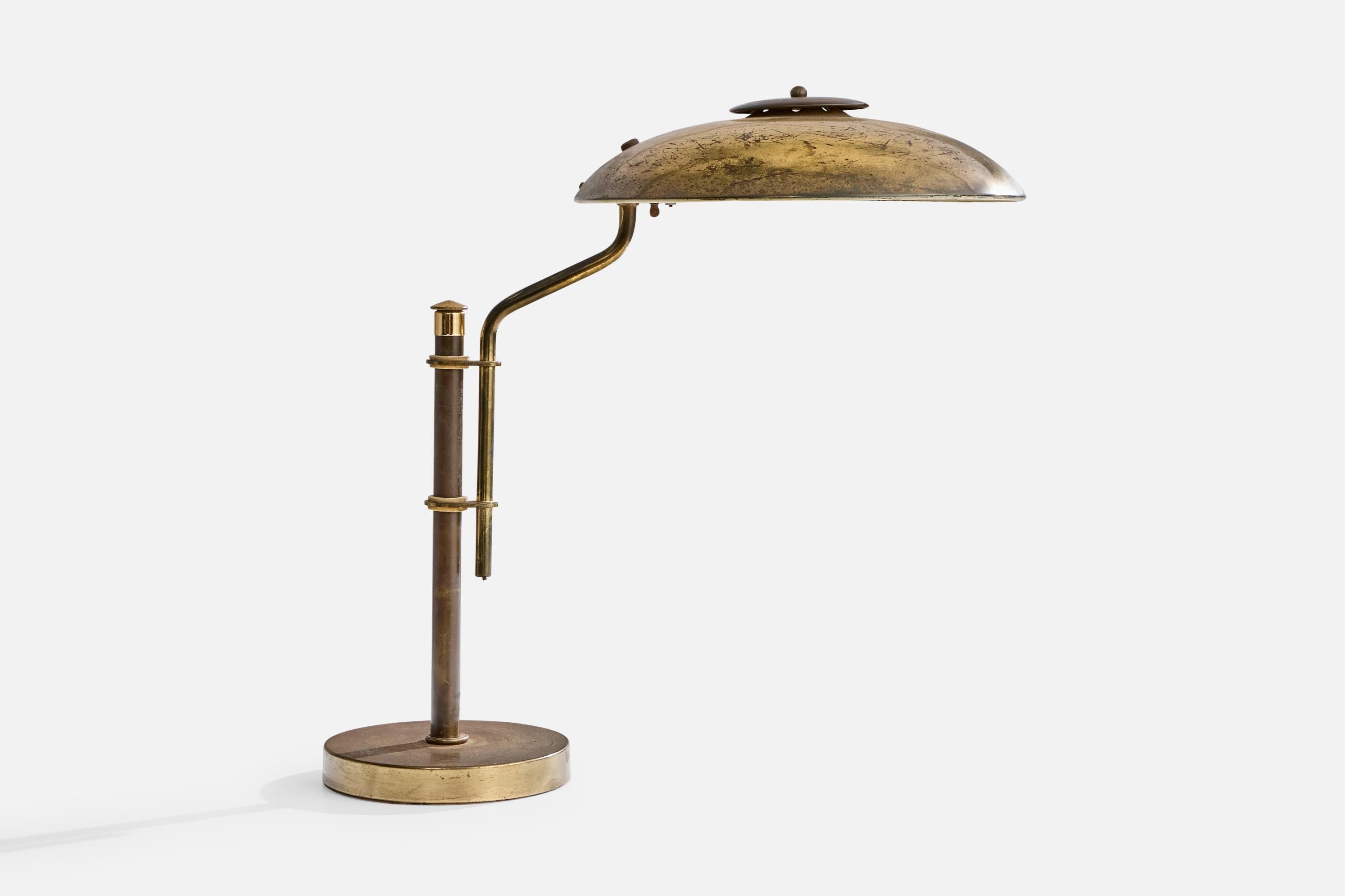 An adjustable brass table lamp designed and produced in the US, c. 1930s.

Dimensions of Lamp (inches): 18.5