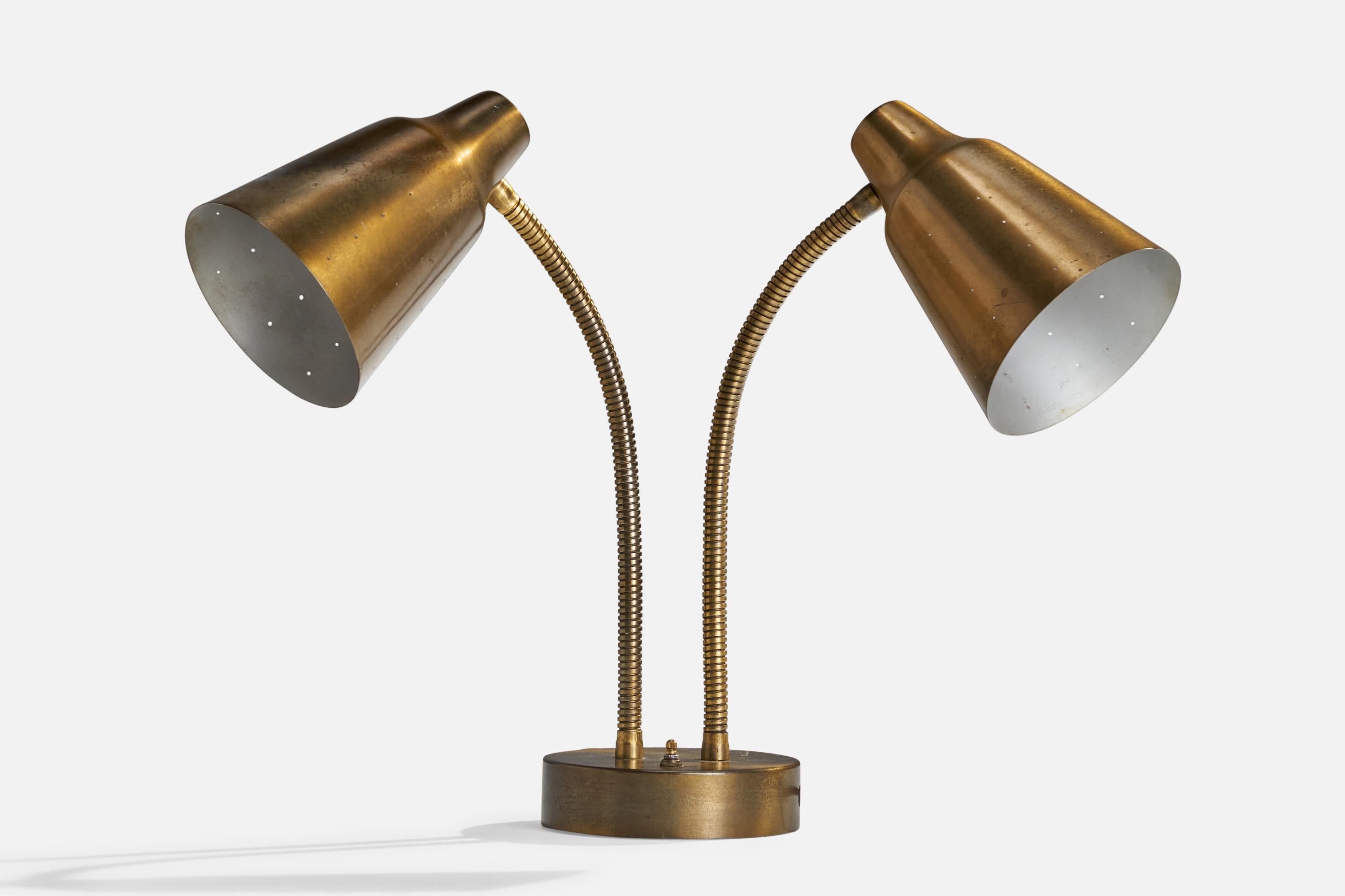 A two-armed brass table lamp designed and produced in the US, 1950s.

Overall Dimensions (inches): 17” H x 21.5” W x 12.75” D
Bulb Specifications: E-26 Bulb
Number of Sockets: 2
All lighting will be converted for US usage. We are unable to confirm