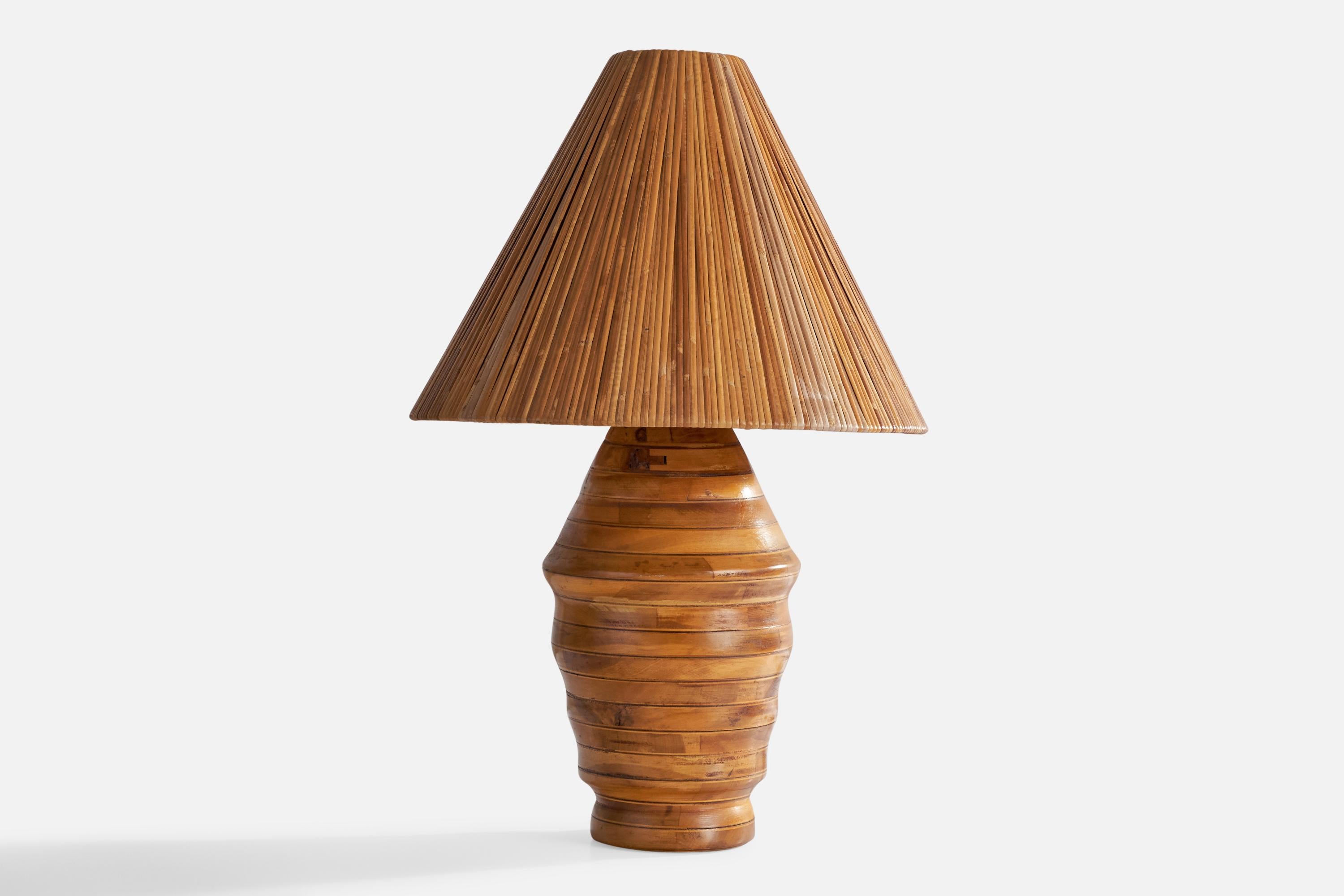 A hickory and rattan table lamp designed and produced in the US, 1950s.

Overall Dimensions (inches): 24.5” H x 16” D
Stated dimensions include shade.
Bulb Specifications: E-26 Bulb
Number of Sockets: 1
All lighting will be converted for US usage.
