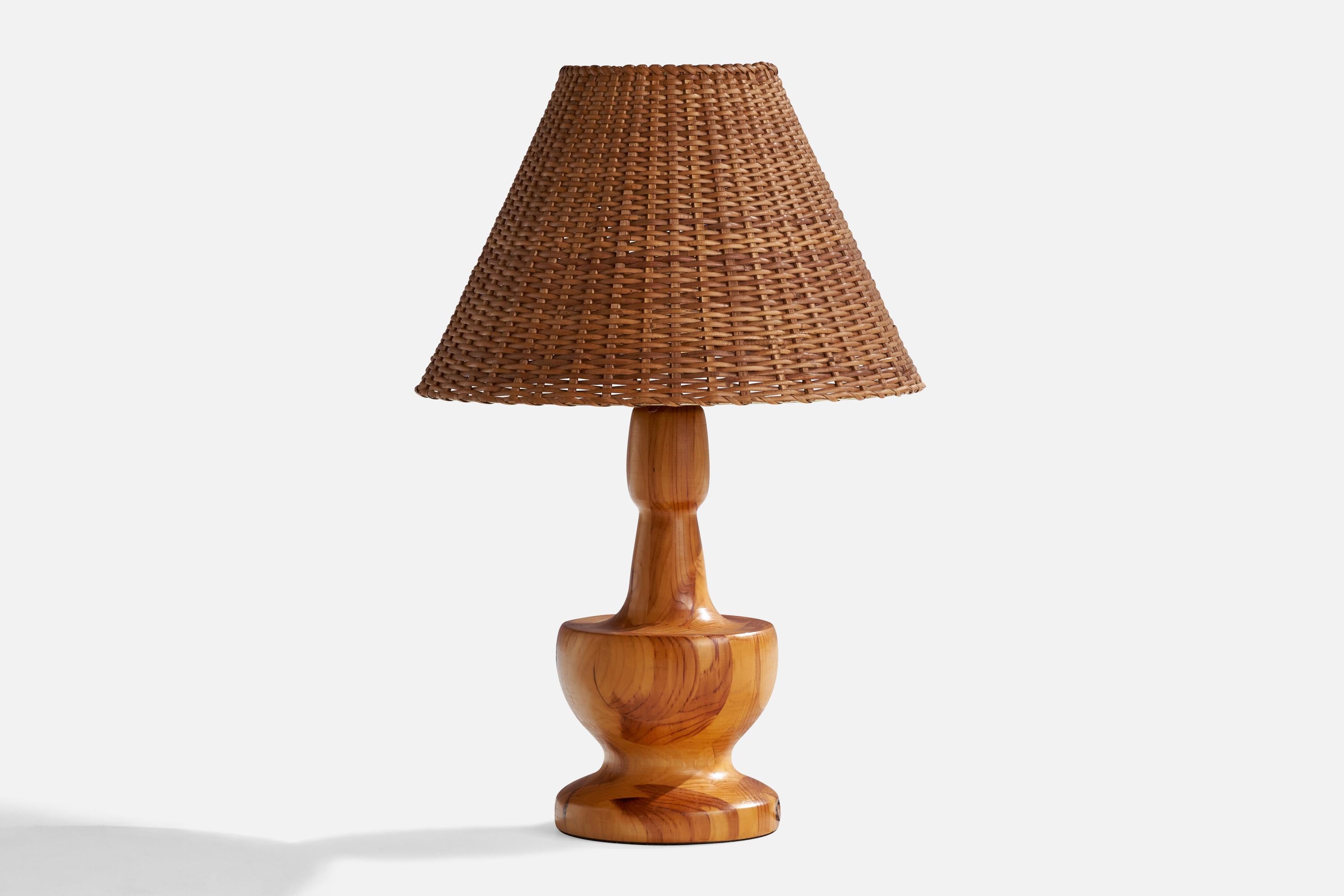 A hickory wood and rattan table lamp designed and produced in the US, 1950s. 

Overall Dimensions (inches): 26” H x 7”Diameter 
Stated dimensions include shade.
Bulb Specifications: E-26 Bulb
Number of Sockets: 1
All lighting will be converted for