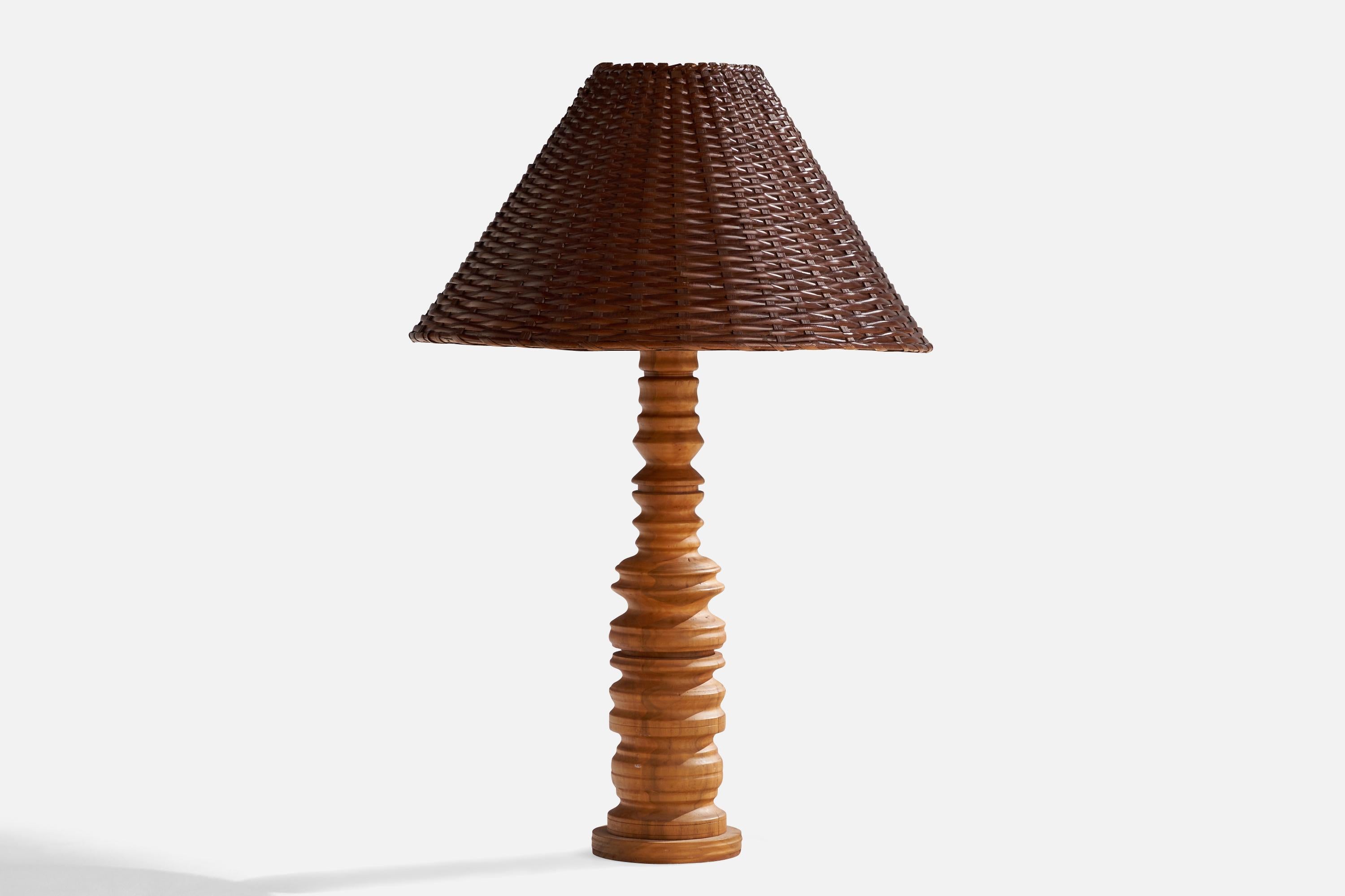 A sizeable hickory wood and rattan table lamp designed and produced in the US, c. 1960s. 

Overall Dimensions (inches): 29” H x 18.75 Diameter 
Stated dimensions include shade.
Bulb Specifications: E-26 Bulb
Number of Sockets: 1
All lighting will be