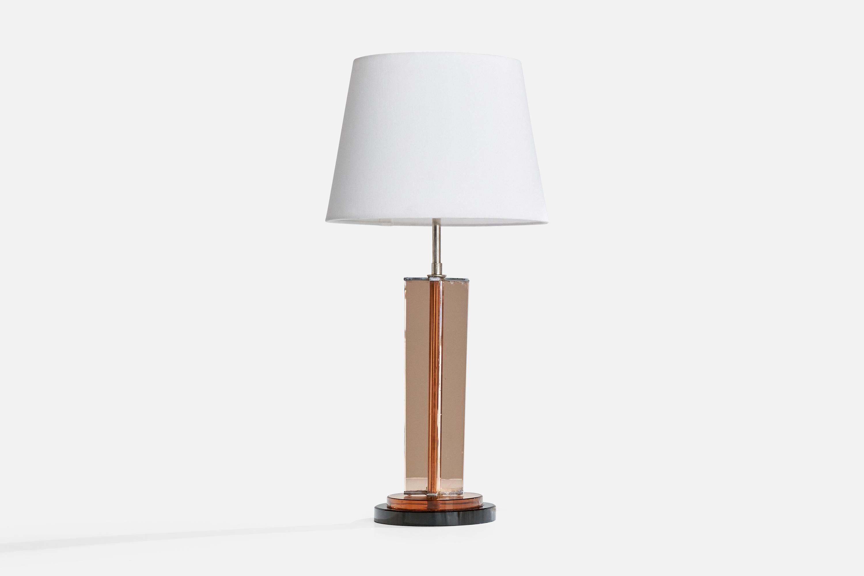 A pink-colored glass, black marble and chrome metal table lamp designed and produced in the US, c. 1980s.

Dimensions of Lamp (inches): 24.25“ H x 6.5“ Diameter

Dimensions of Shade (inches): 9” Top Diameter x 12“ Bottom Diameter x 9“ H

Dimensions