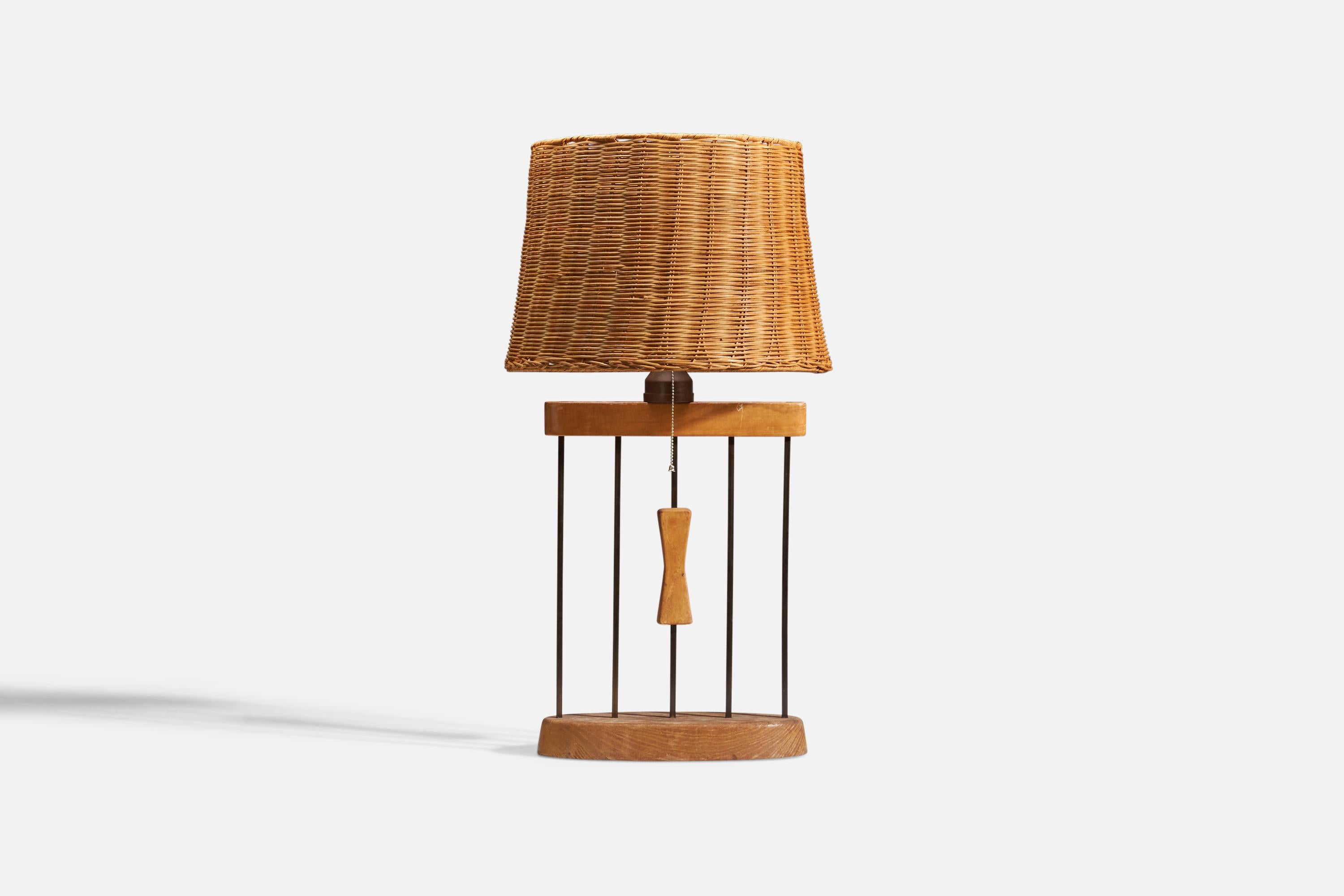 A metal, brass and oak table lamp designed and produced in the United States, 1950s.

Sold with Lampshade
Dimensions of lamp (inches) : 22.31 x 13.75 x 5.81 (height x width x depth)
Dimensions of lampshade (inches) : 13.75 x 16.5 x 11.5 (top