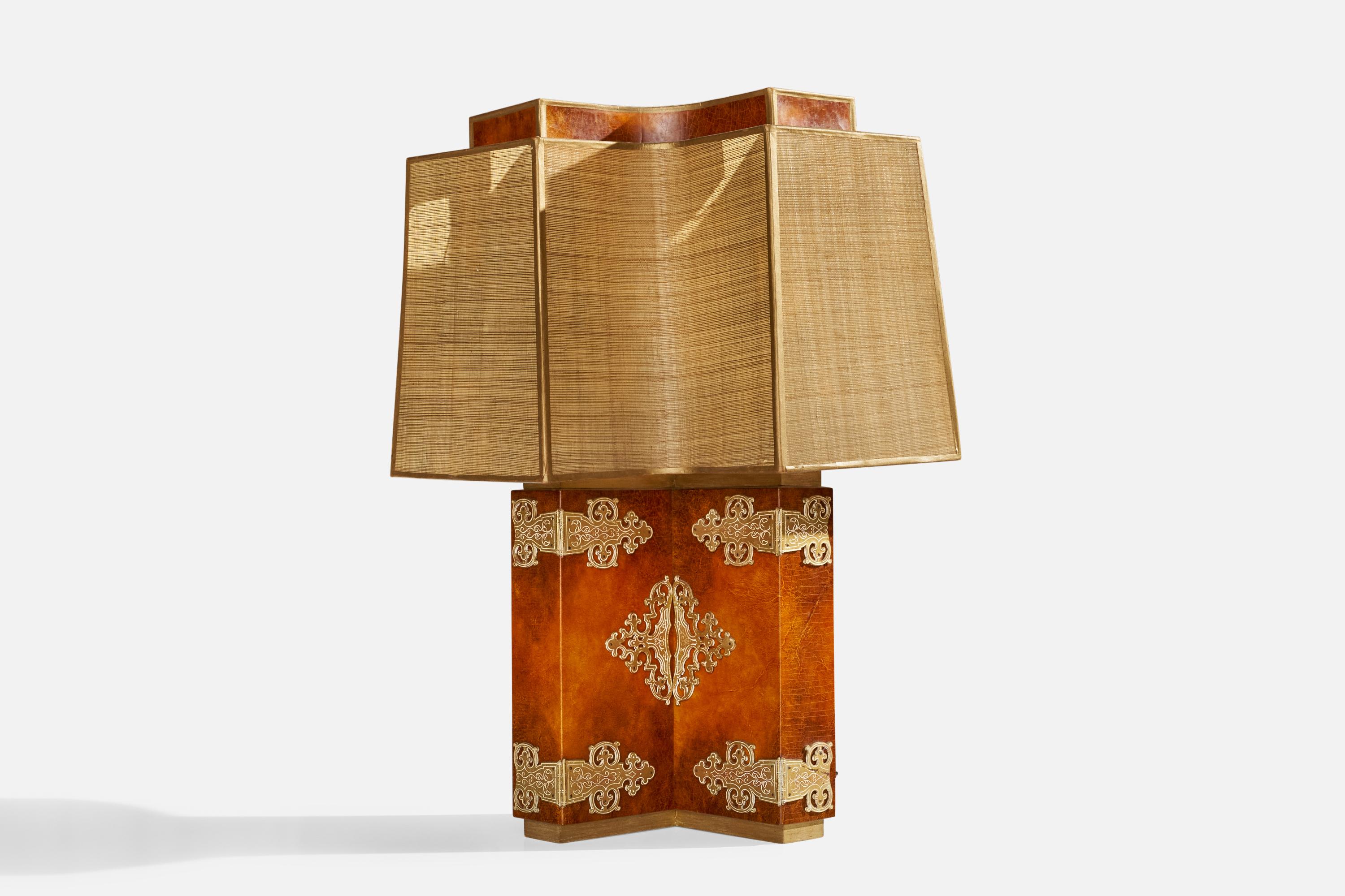 A gilt and painted wood, raffia and painted fiberglass table lamp designed and produced in the US, c. 1950s.

Overall Dimensions (inches): 33.5” H x 26” W x 8” D
Stated dimensions include shade.
Bulb Specifications: E-26 Bulb
Number of Sockets: