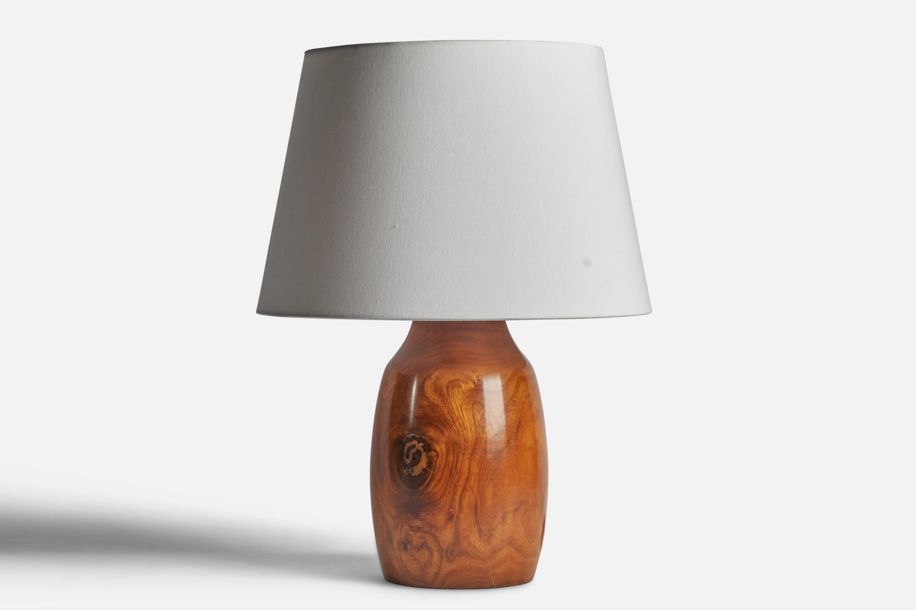 A wood table lamp designed and produced in the US, c. 1950s.

Dimensions of Lamp (inches): 16.75” H x 7.25” Diameter
Dimensions of Shade (inches): 12” Top Diameter x 16” Bottom Diameter x 11” H 
Dimensions of Lamp with Shade (inches): 22” H x 16”