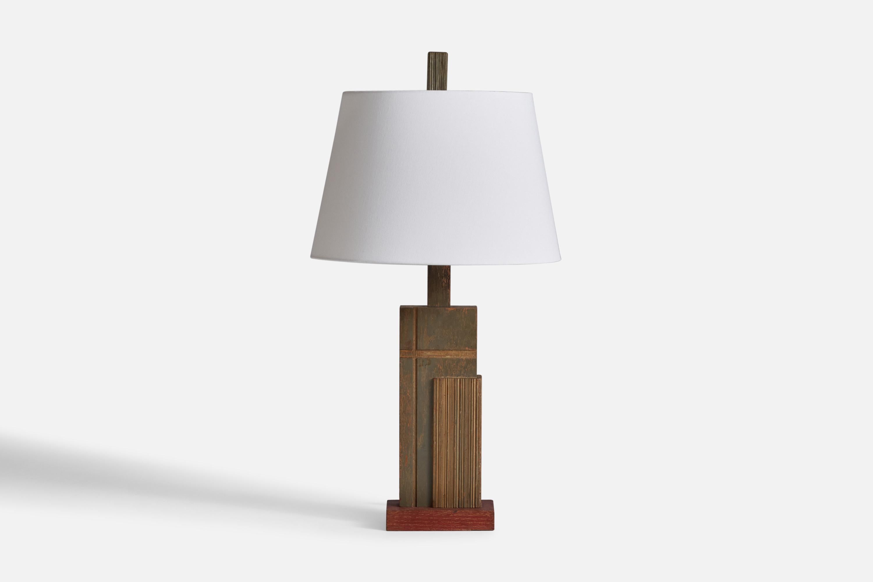 A green-painted wood table lamp designed and produced in the US, 1950s.

Dimensions of Lamp (inches): 28” H x 4.1” Diameter
Dimensions of Shade (inches): 12” Top Diameter x 16” Bottom Diameter x 10.5” H
Dimensions of Lamp with Shade (inches): 28” H