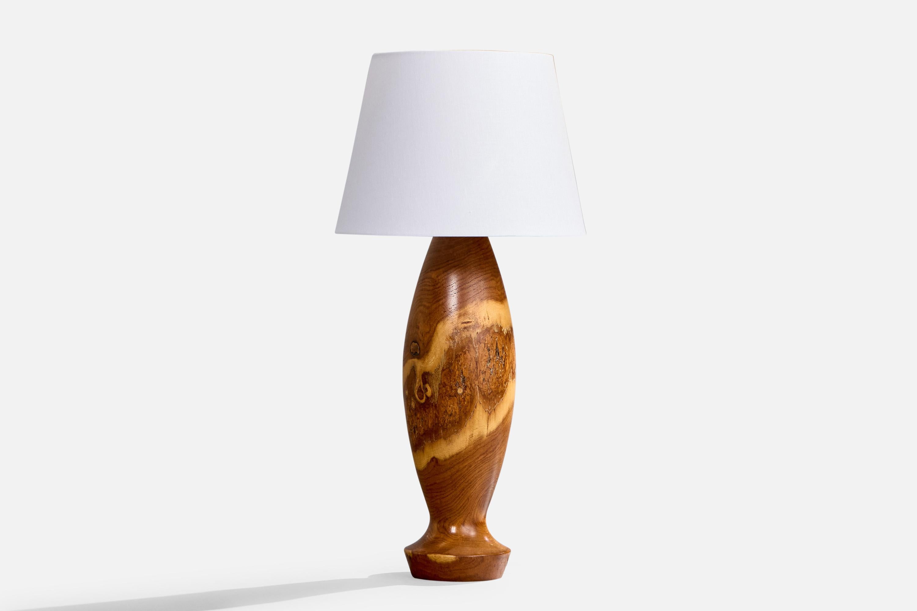 A large wood table lamp designed and produced in the US, c. 1950s.

Dimensions of Lamp: 23.5” H x 6.2” Diameter 

Dimensions of Shade: 10” Top Diameter x 14” Bottom Diameter x 10” H 

Dimensions of Lamp with Shade: 29” H x 14