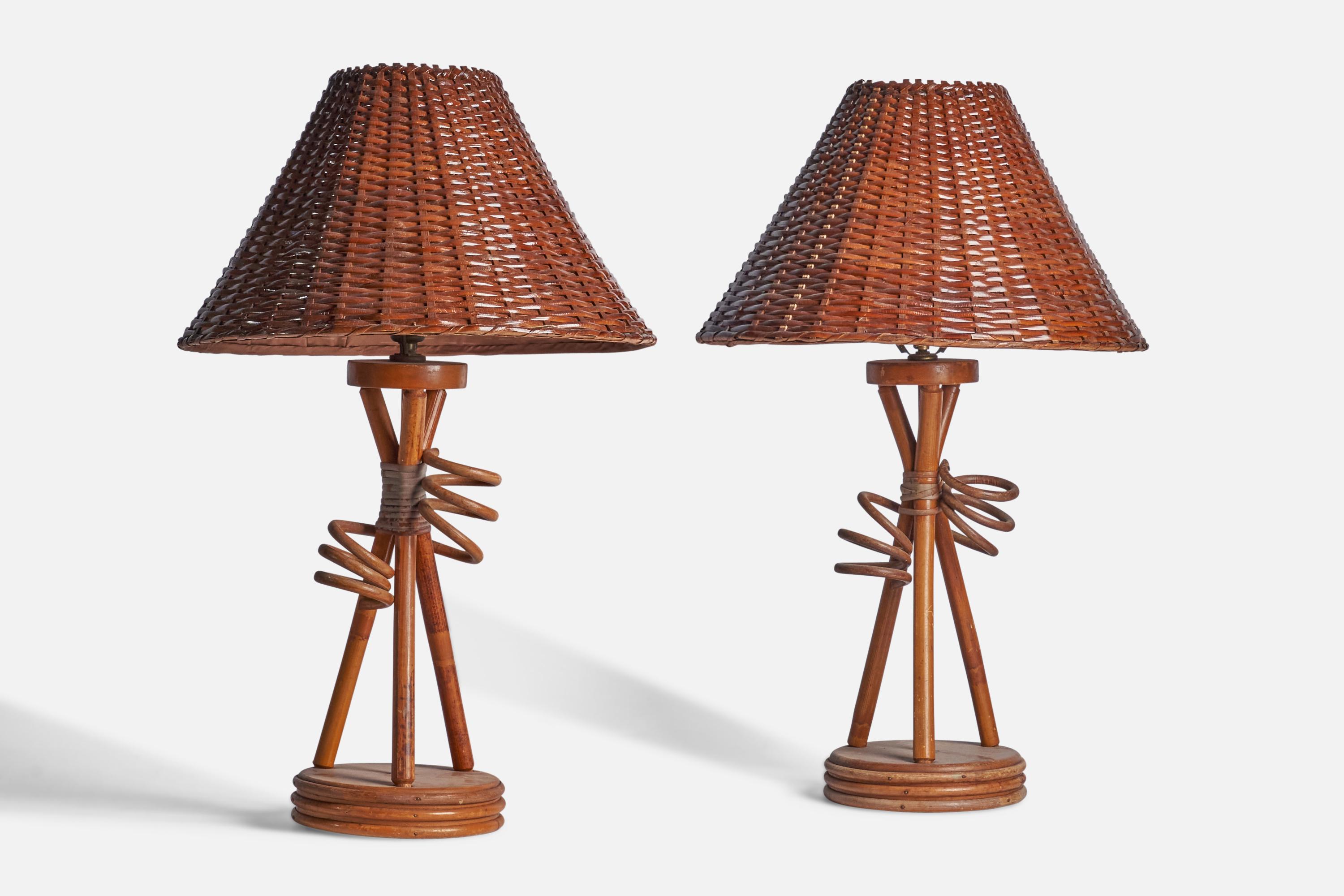 A pair of rattan and bamboo table lamps designed and produced in the US, 1950s.

Overall Dimensions (inches): 28