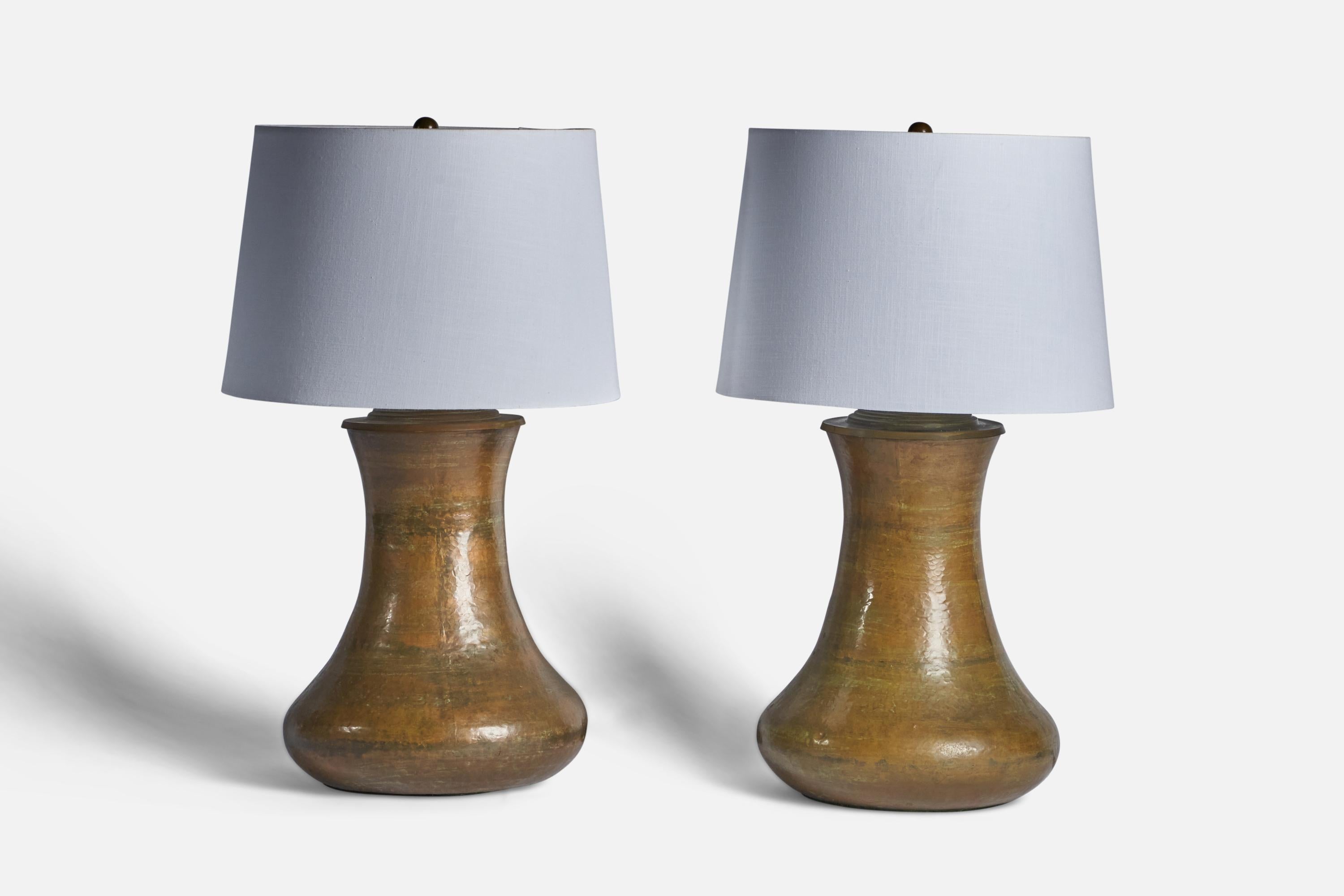 A pair of sizeable brass table lamps designed and produced in the US, c. 1970s.

Dimensions of Lamp (inches): 24.5” H x 12” Diameter
Dimensions of Shade (inches): 13” Top Diameter x 15” Bottom Diameter x 10” H 
Dimensions of Lamp with Shade