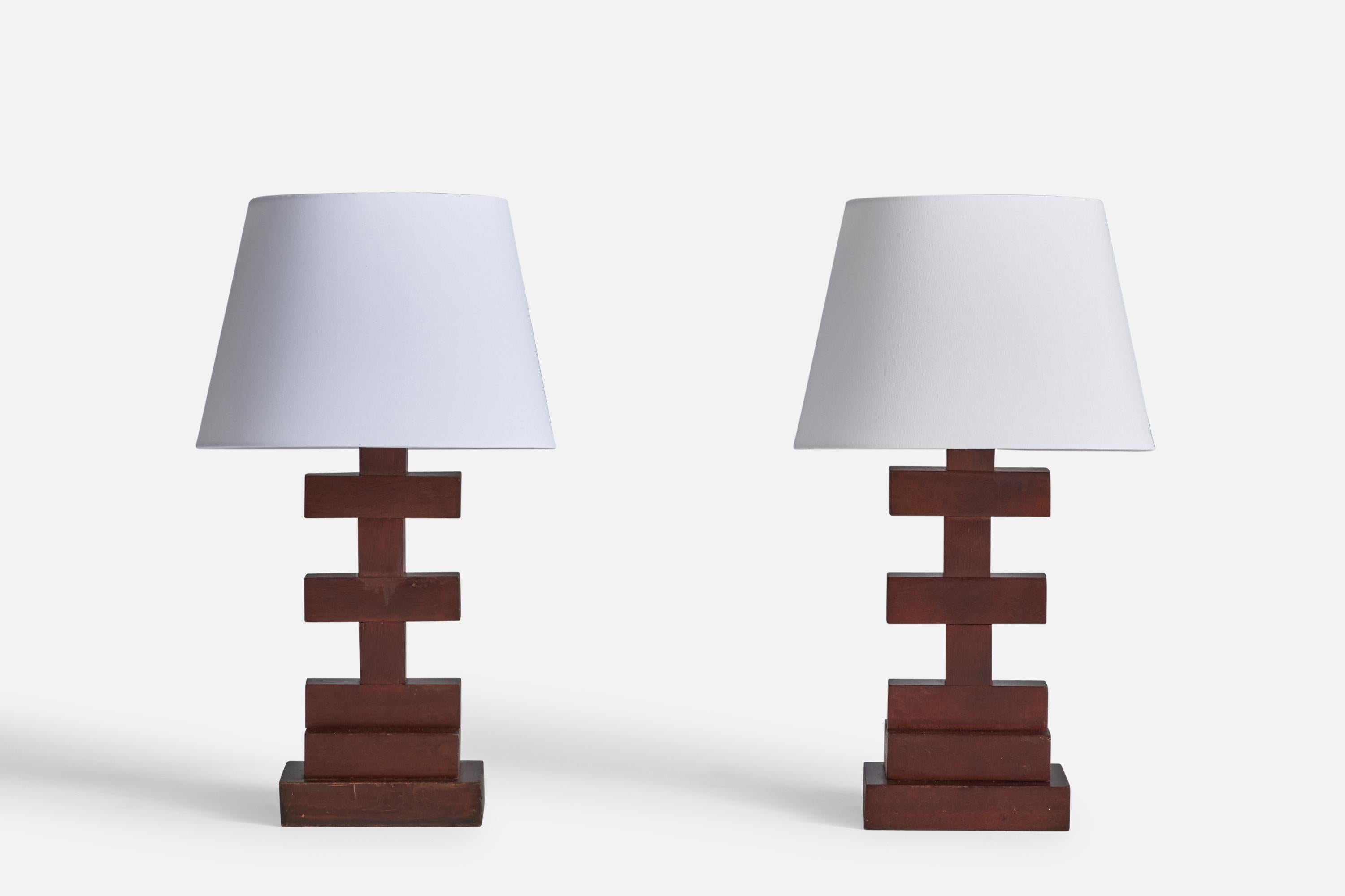 A pair of sizeable walnut table lamps designed and produced in the US, c. 1940s.

Dimensions of Lamp (inches): 18.5”  H x 5.5” Diameter
Dimensions of Shade (inches): 10