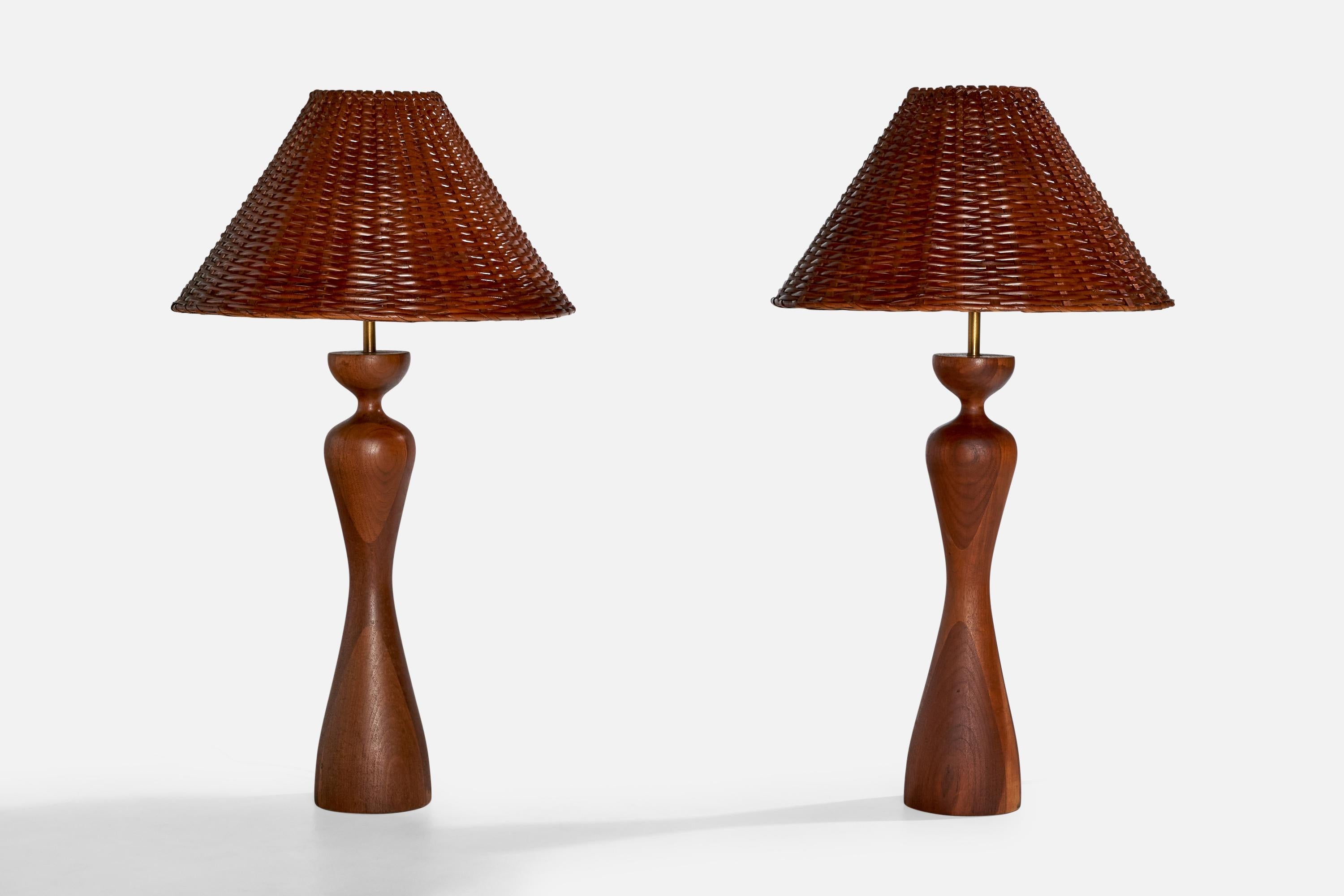 A pair of stained wood, brass and rattan table lamps designed and produced in the US, c. 1950s

Dimensions of Lamp with Shade (inches): 34.675“ H x 19.375“ Diameter

Bulb Specifications: E-26 

Number of Sockets (per fixture): 1

Sold with