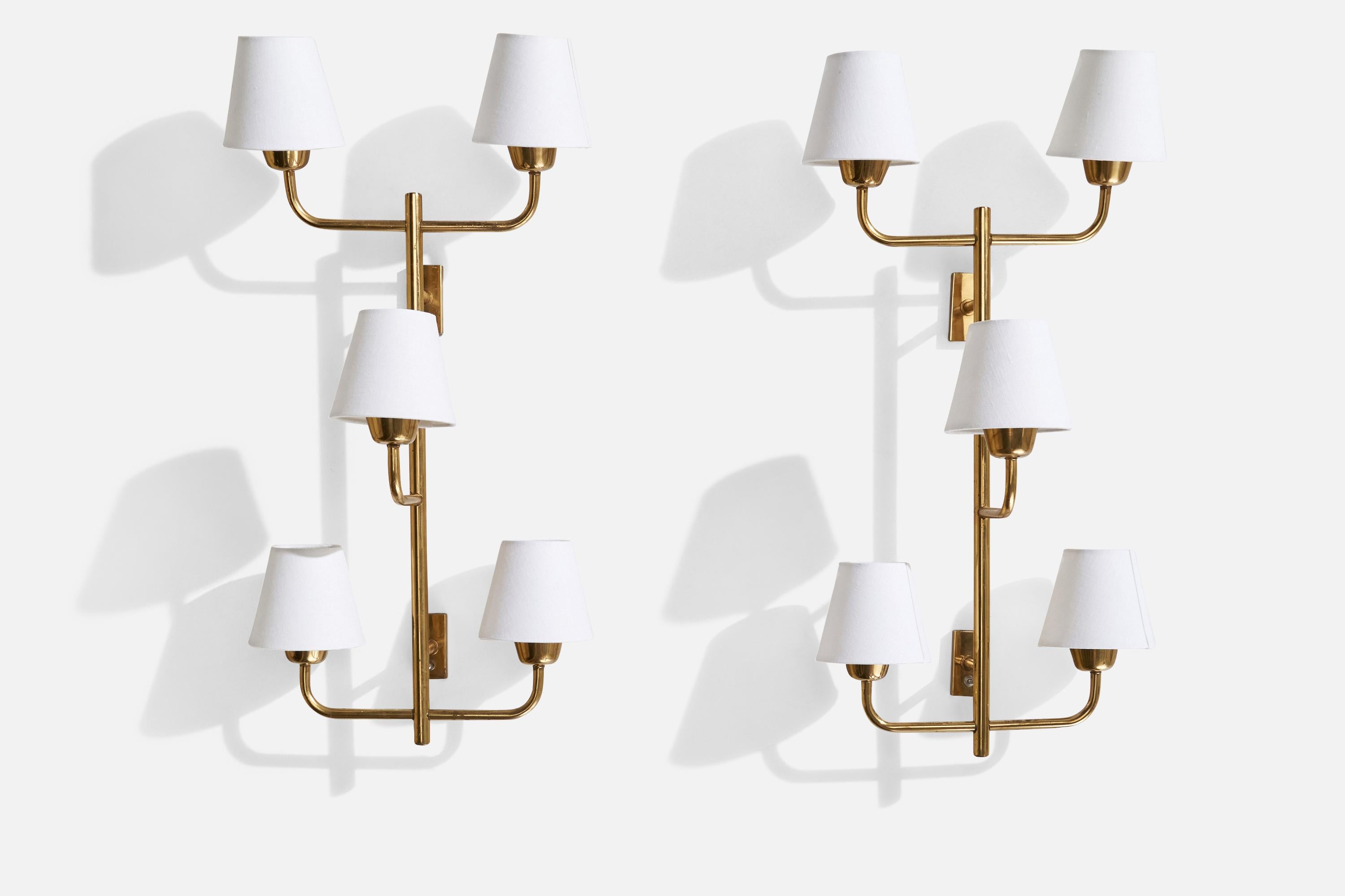 A pair of 5-armed brass and white fabric wall lights designed and produced in the US, c. 1960s.

Overall Dimensions (inches): 31.25” H x 15” W x 9” D
Back Plate Dimensions (inches): 3.08” H x 1.50” W x 0.50” D
Bulb Specifications: E-26 Bulb
Number