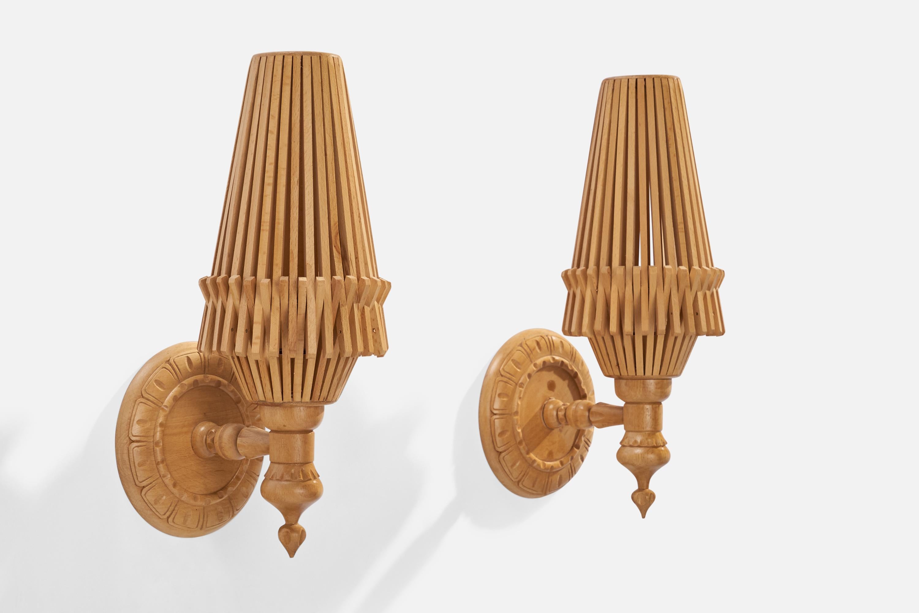 A pair of maple wall lights designed and produced in the US, 1960s.

Overall Dimensions (inches): 16”  H x 6” W x 7” D
Back Plate Dimensions (inches): 6.25” W x .75” D
Bulb Specifications: E-14 Bulb
Number of Sockets: 2
All lighting will be