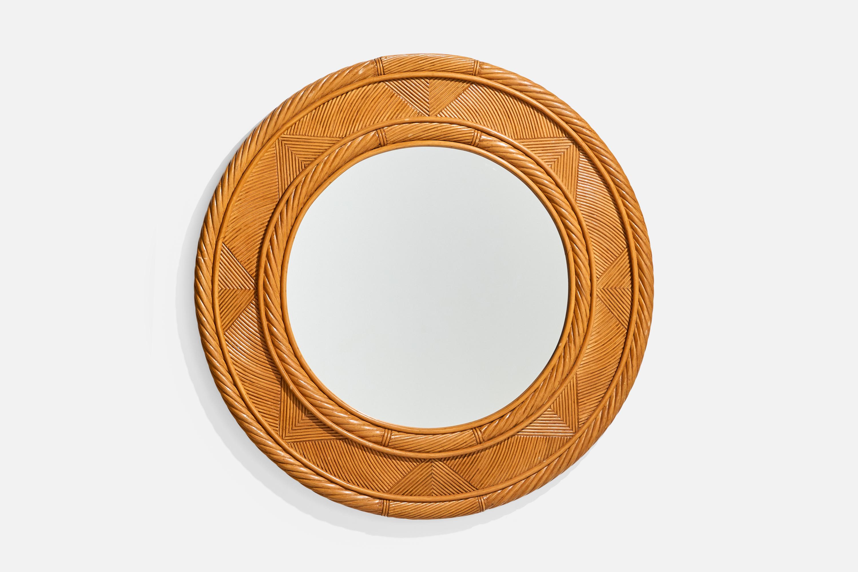 A sizable bamboo wall mirror designed and produced in the US, c. 1970s.

Dimensions: 39” Diameter x 2” D