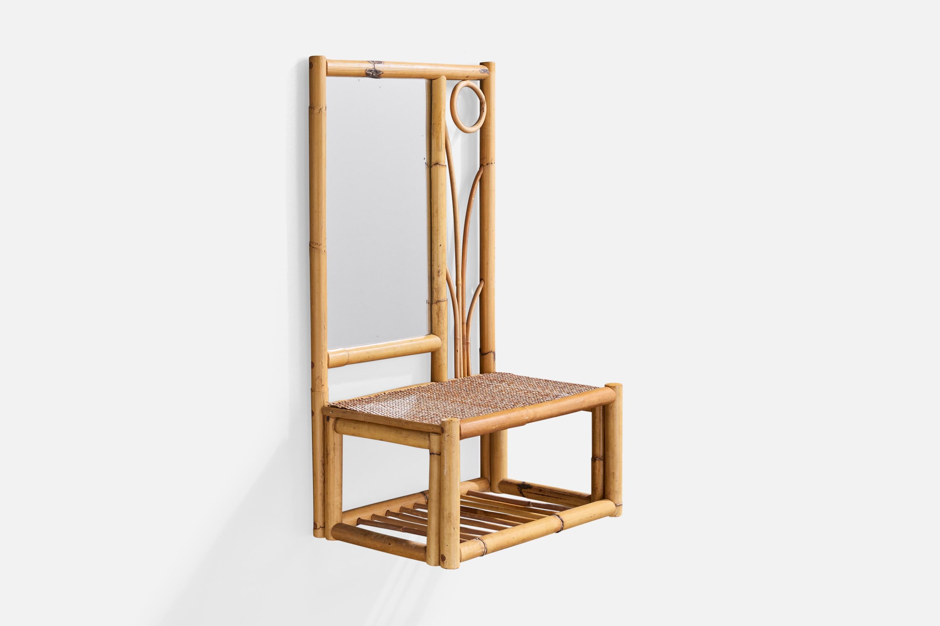 A bamboo and rattan wall mirror with console likely designed and produced in the US, c. 1950s.

Overall Dimensions (inches): 26.9