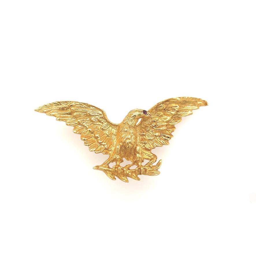 Very Patriot 14K gold  American eagle pin with ruby eye, sitting on an olive branch with wings spread.