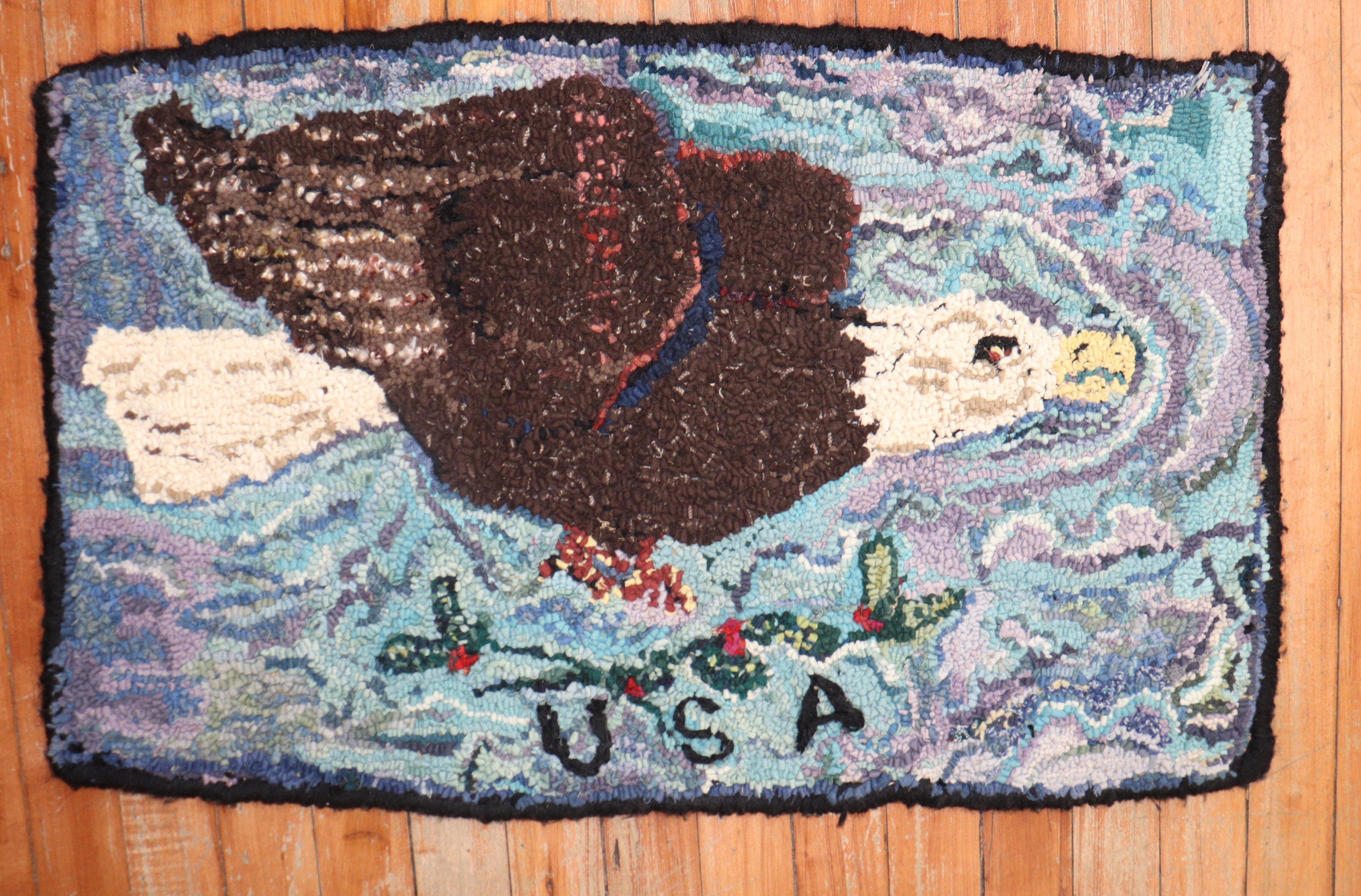 A handmade mini-size American hooked rug from the 3rd quarter of the 20th century showing an American eagle .

Measures: 1'5'' x 2'5''.