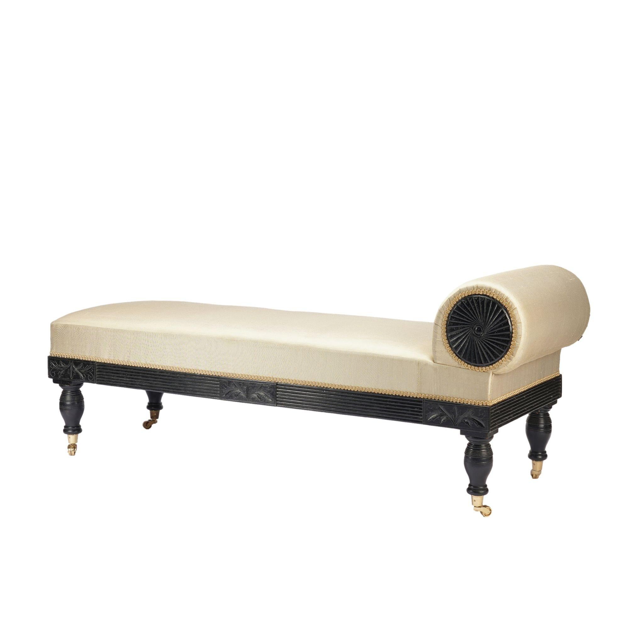 American Eastlake upholstered chaise in ebonized walnut with brass casters, 1888 In Excellent Condition For Sale In Kenilworth, IL