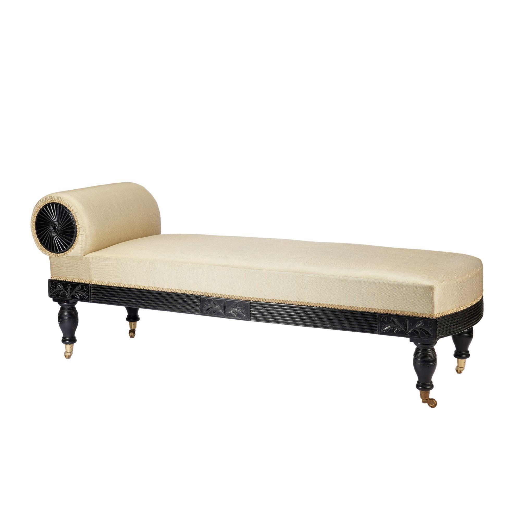 American Eastlake upholstered chaise in ebonized walnut with brass casters, 1888 For Sale 2