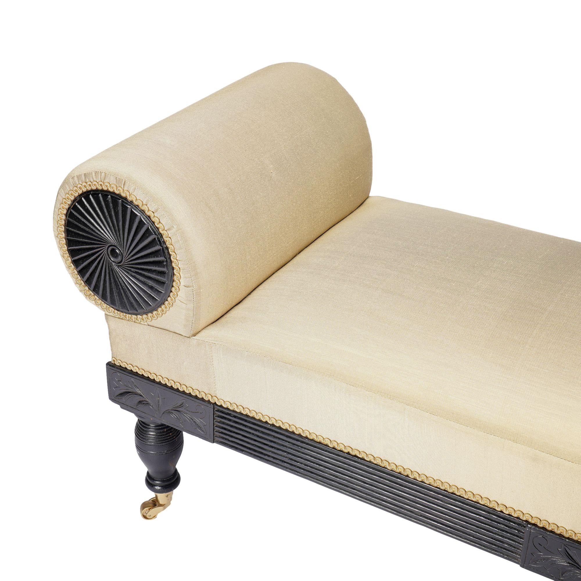 American Eastlake upholstered chaise in ebonized walnut with brass casters, 1888 For Sale 3