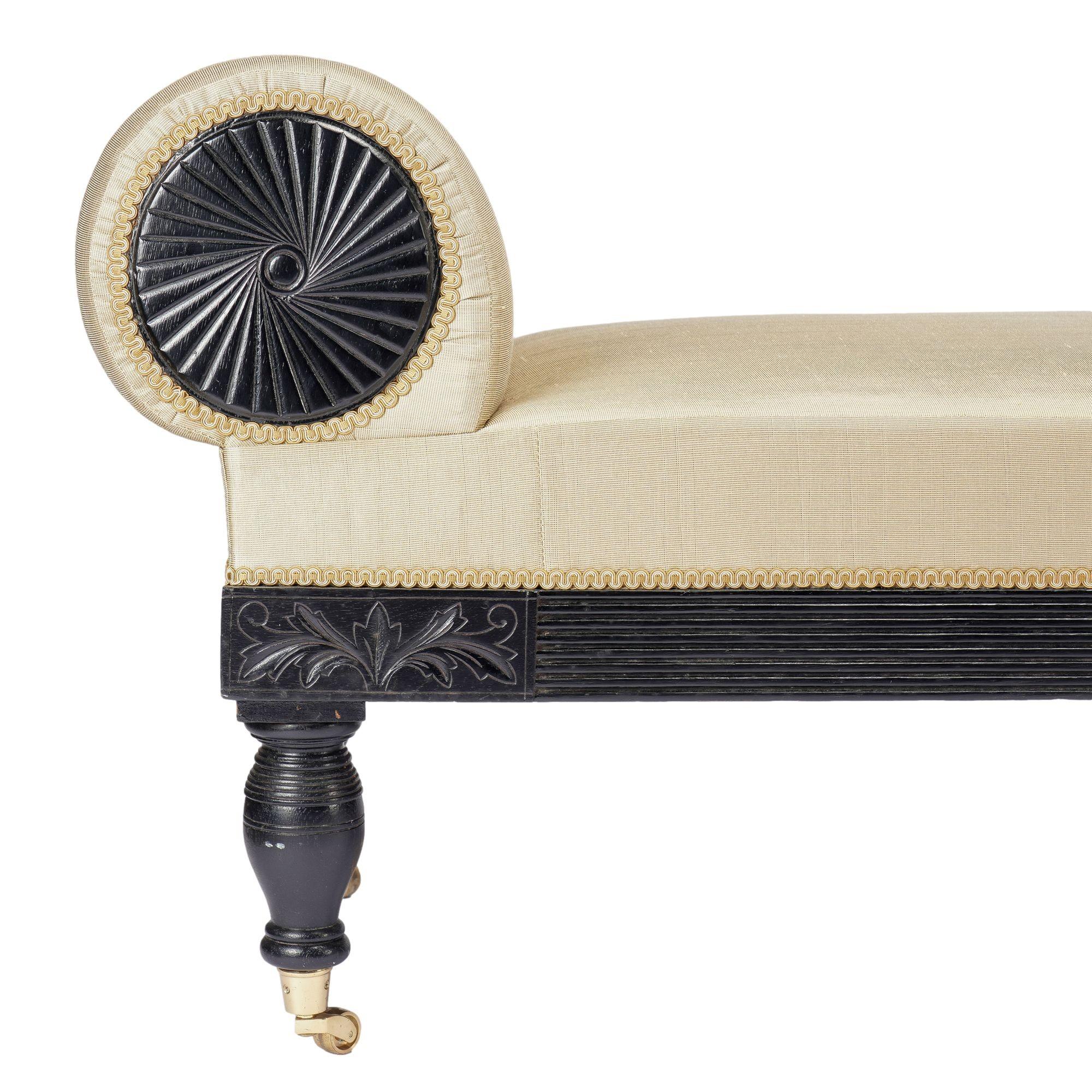 American Eastlake upholstered chaise in ebonized walnut with brass casters, 1888 For Sale 4