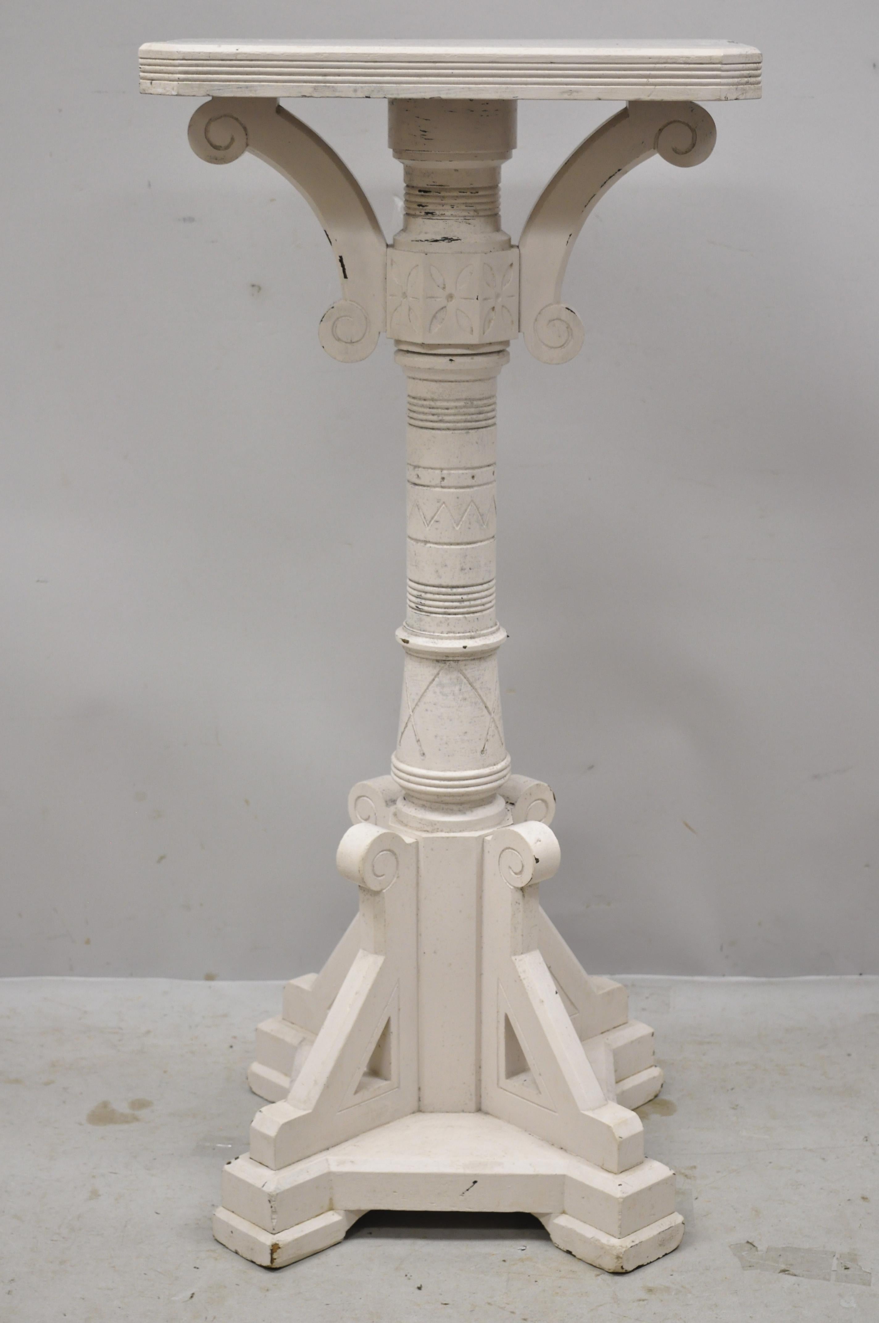 Antique American Eastlake Victorian carved walnut white painted pedestal plant stand. Item features a white painted finish, solid wood construction, nicely carved details, very nice antique item, circa late 19th century. Measurements: 38