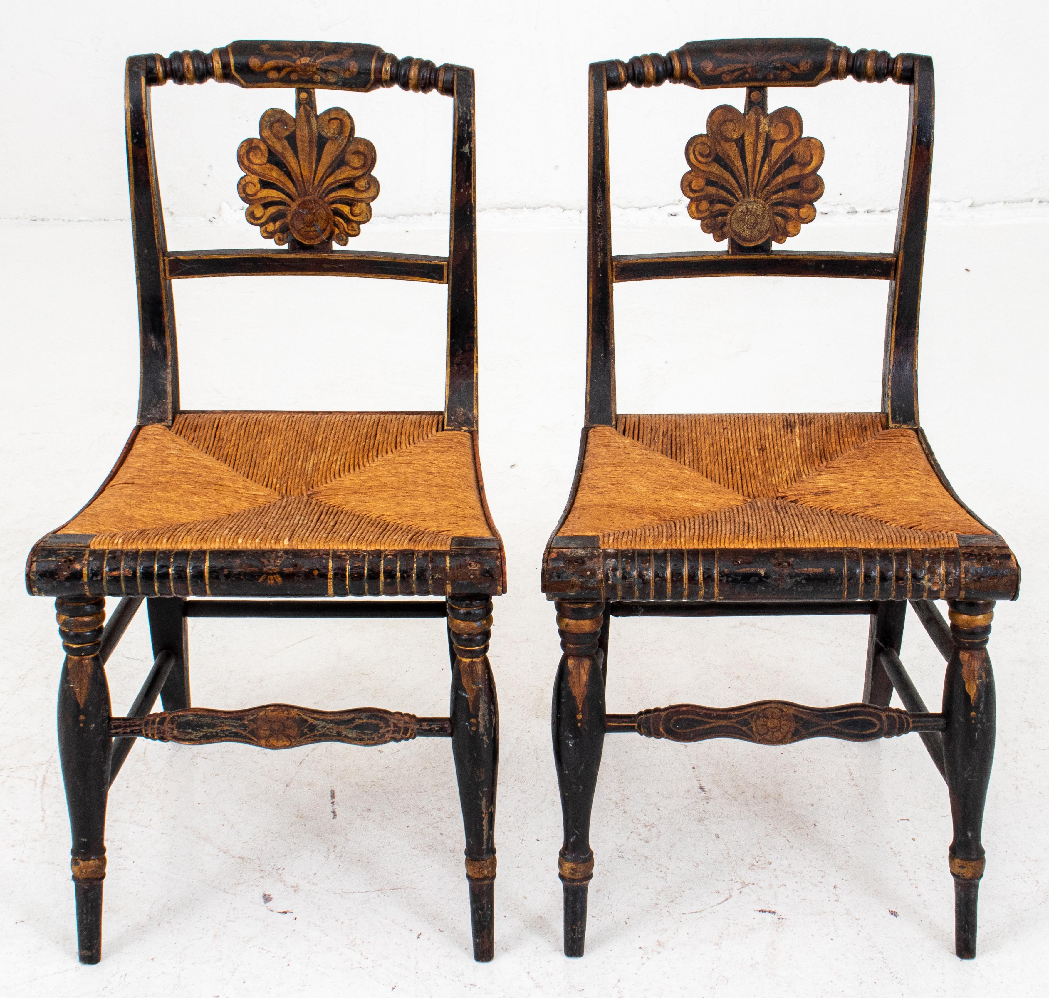Pair of American Empire ebonized and paint decorated side chairs with rush seats, with turned seat backs and legs. 32.5