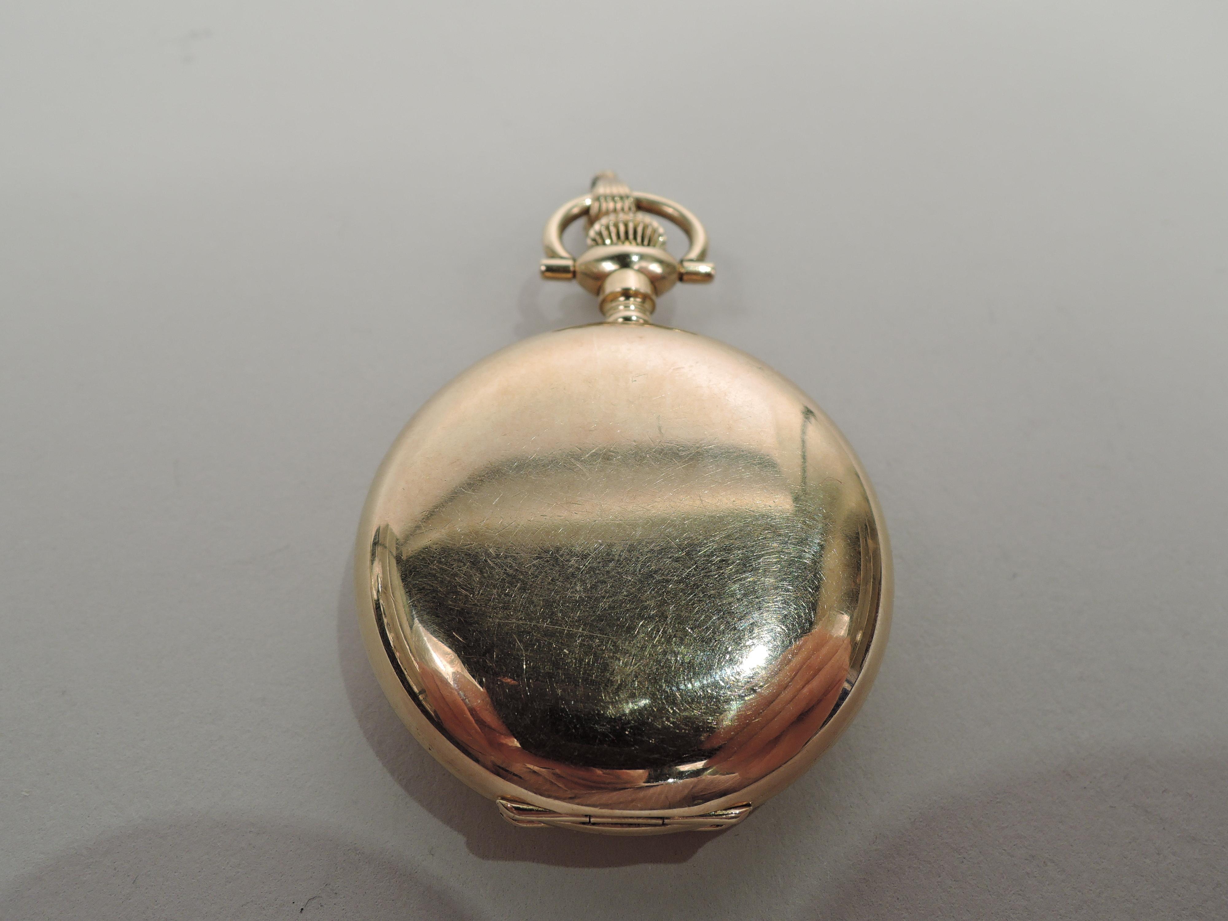 Edwardian 14k yellow gold pendant watch. Round and hinged. Engraved butterfly inlaid with 10 rose-cut diamonds and two ruby beads for exophthalmic eyes. United States, ca 1900. 